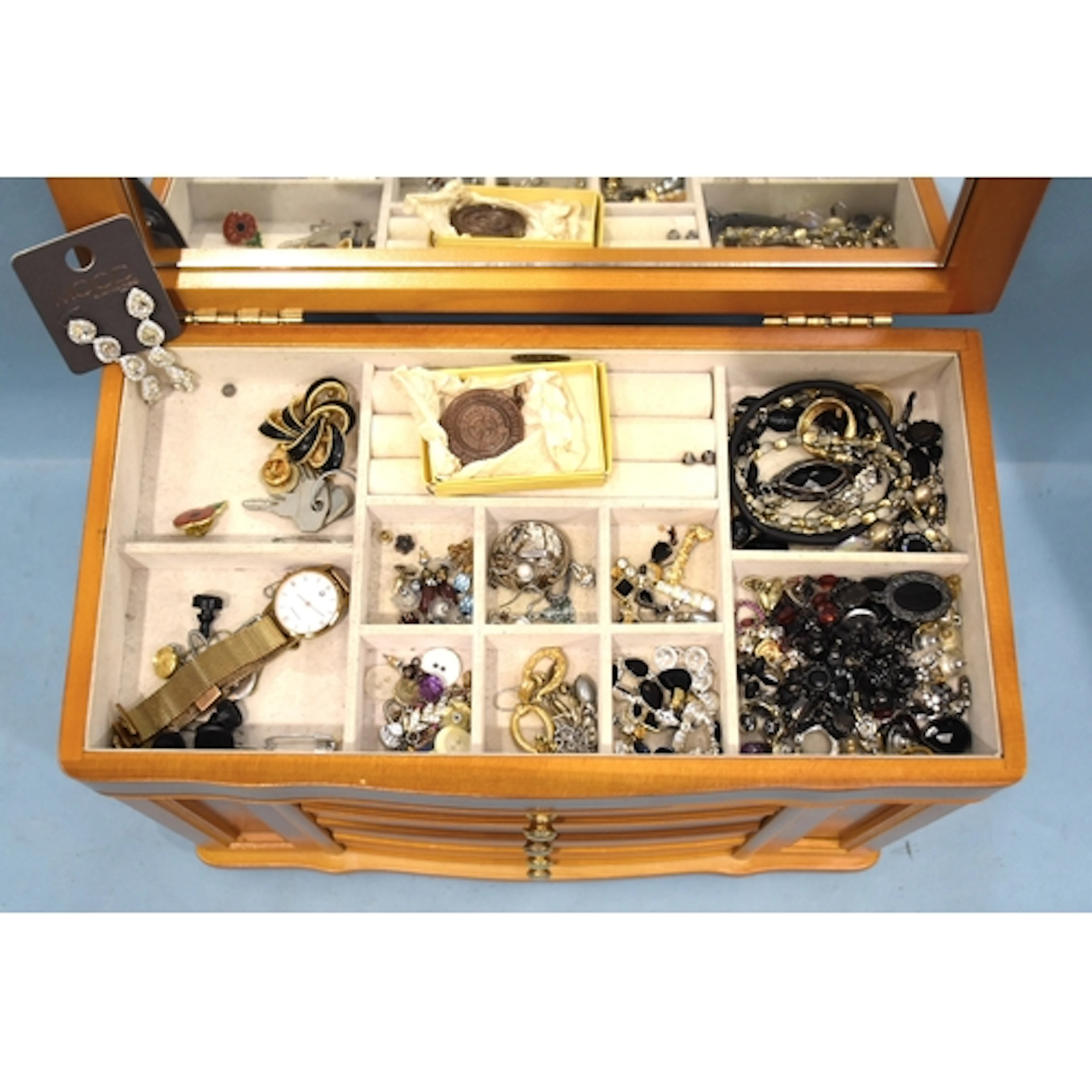 A quantity of costume jewellery, some by Monet, in a wooden ...