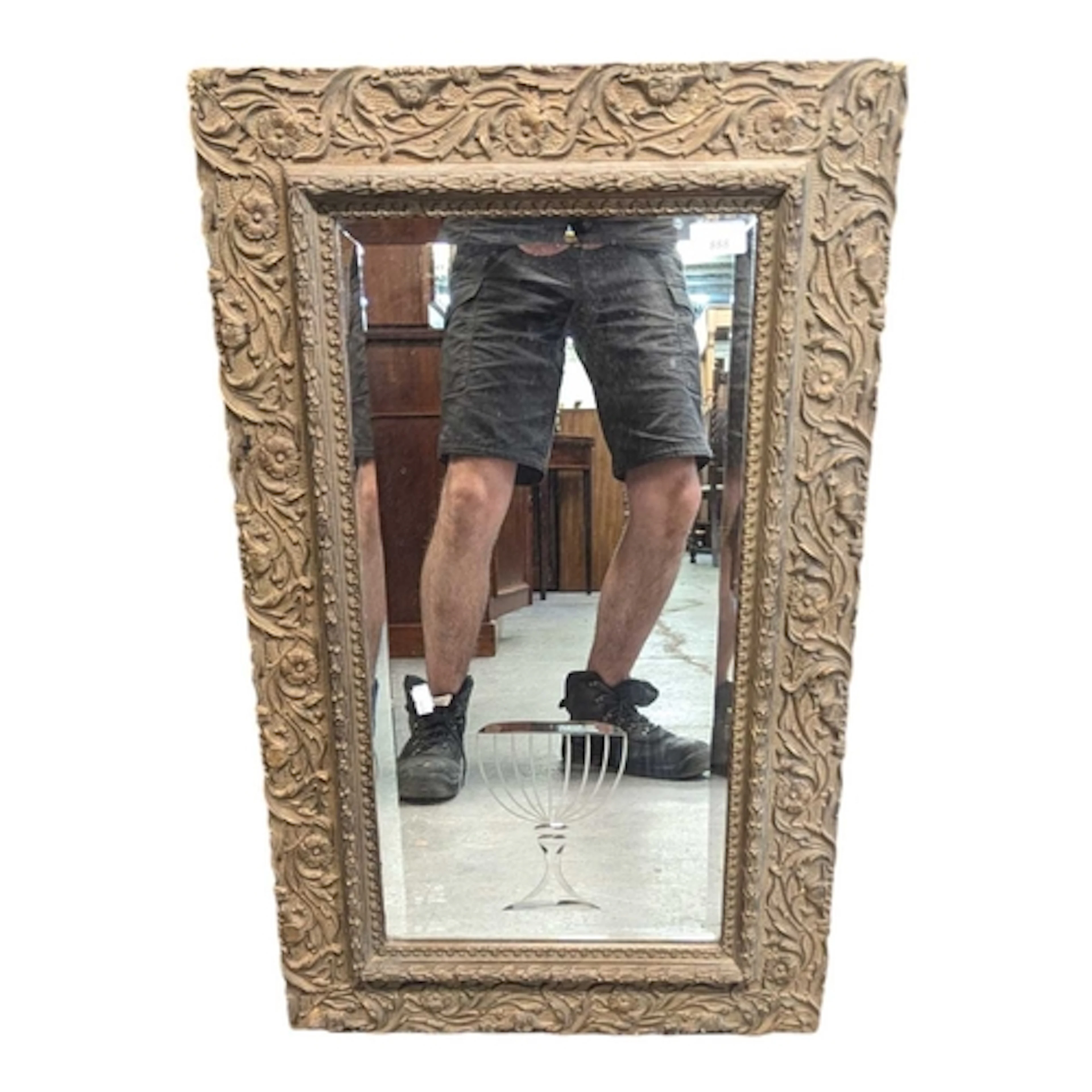 A 19th century French gilt bar mirror. The mirro having orna...