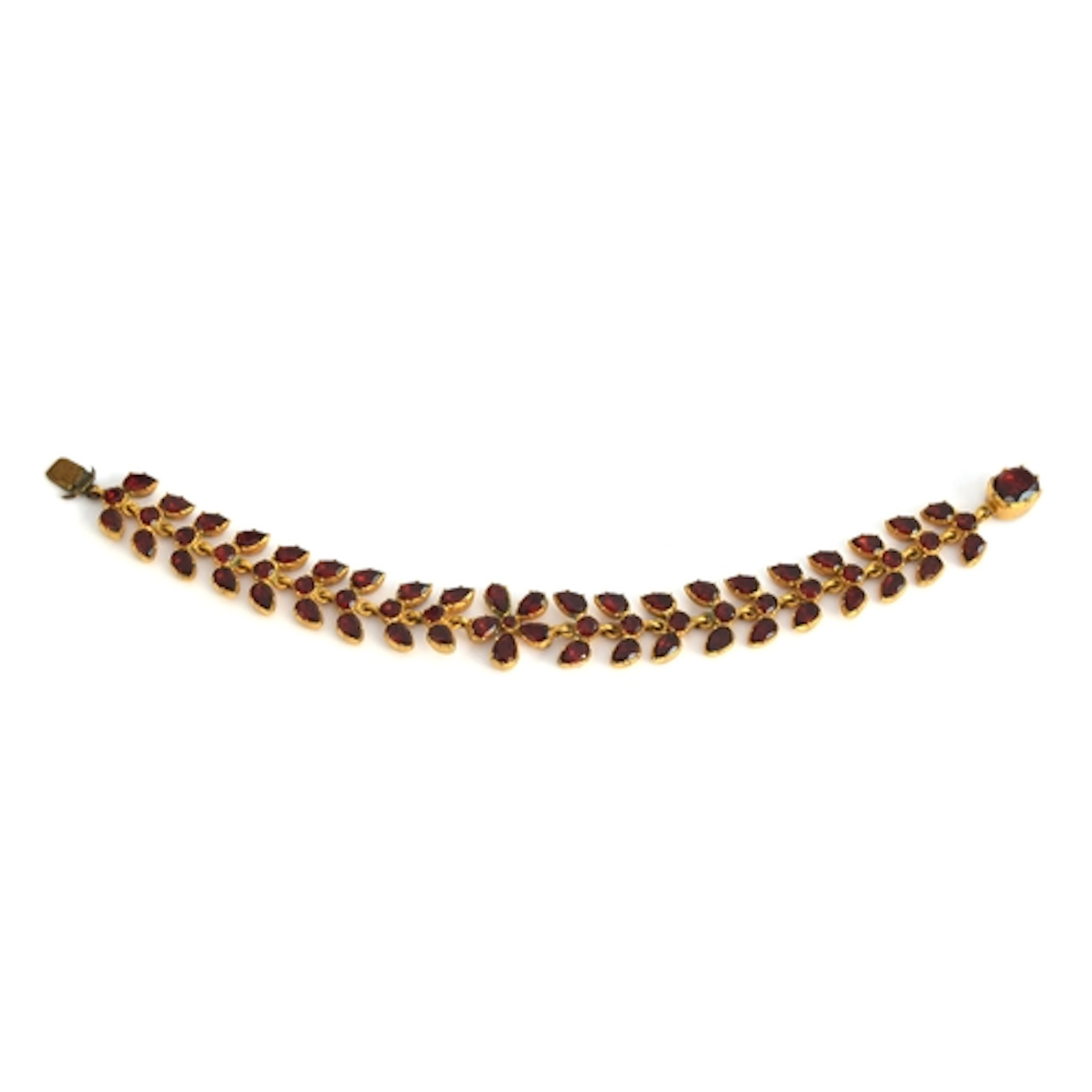 A Georgian gilt metal mounted garnet paste bracelet, formed ...