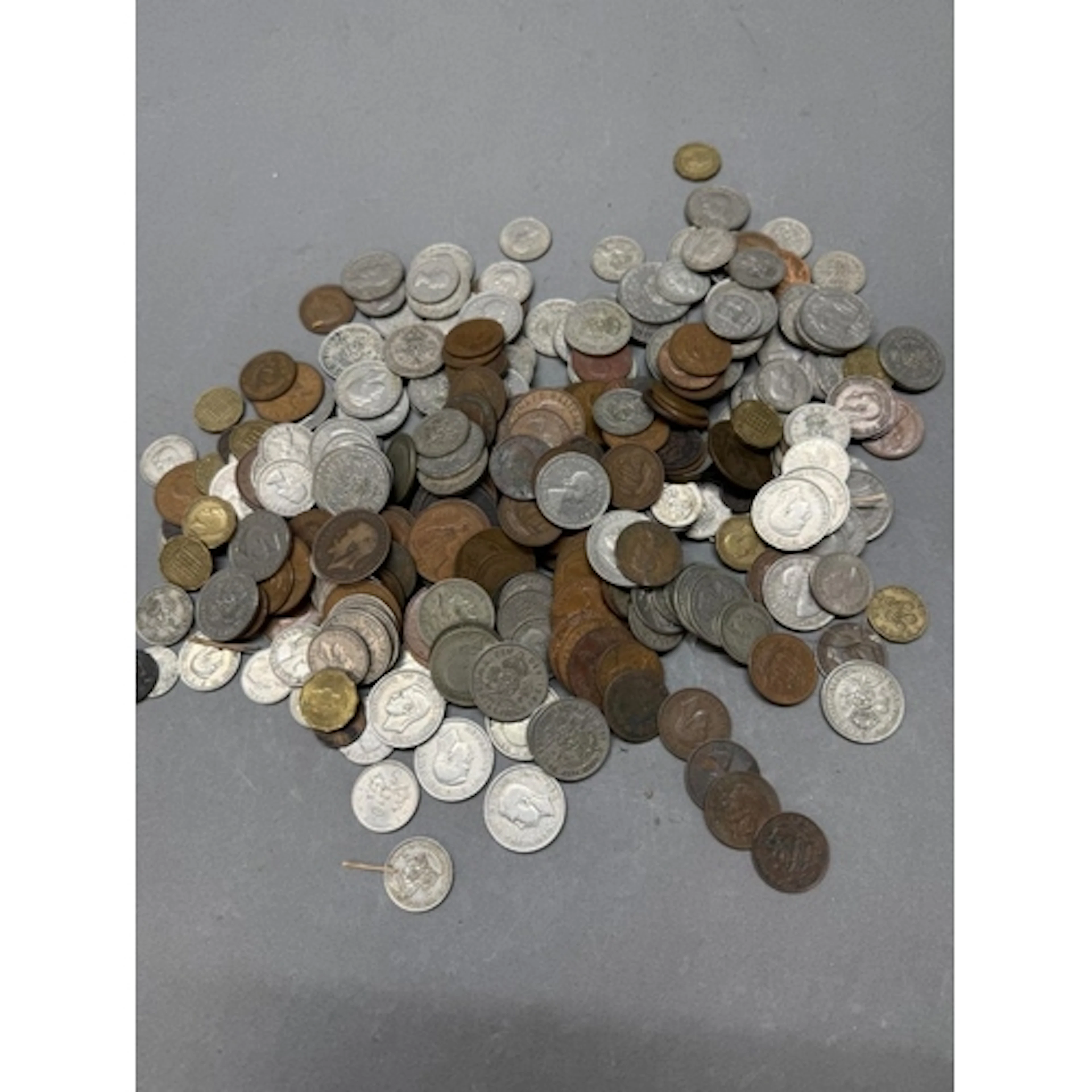 A large selection of UK coins, various denominations, years ...
