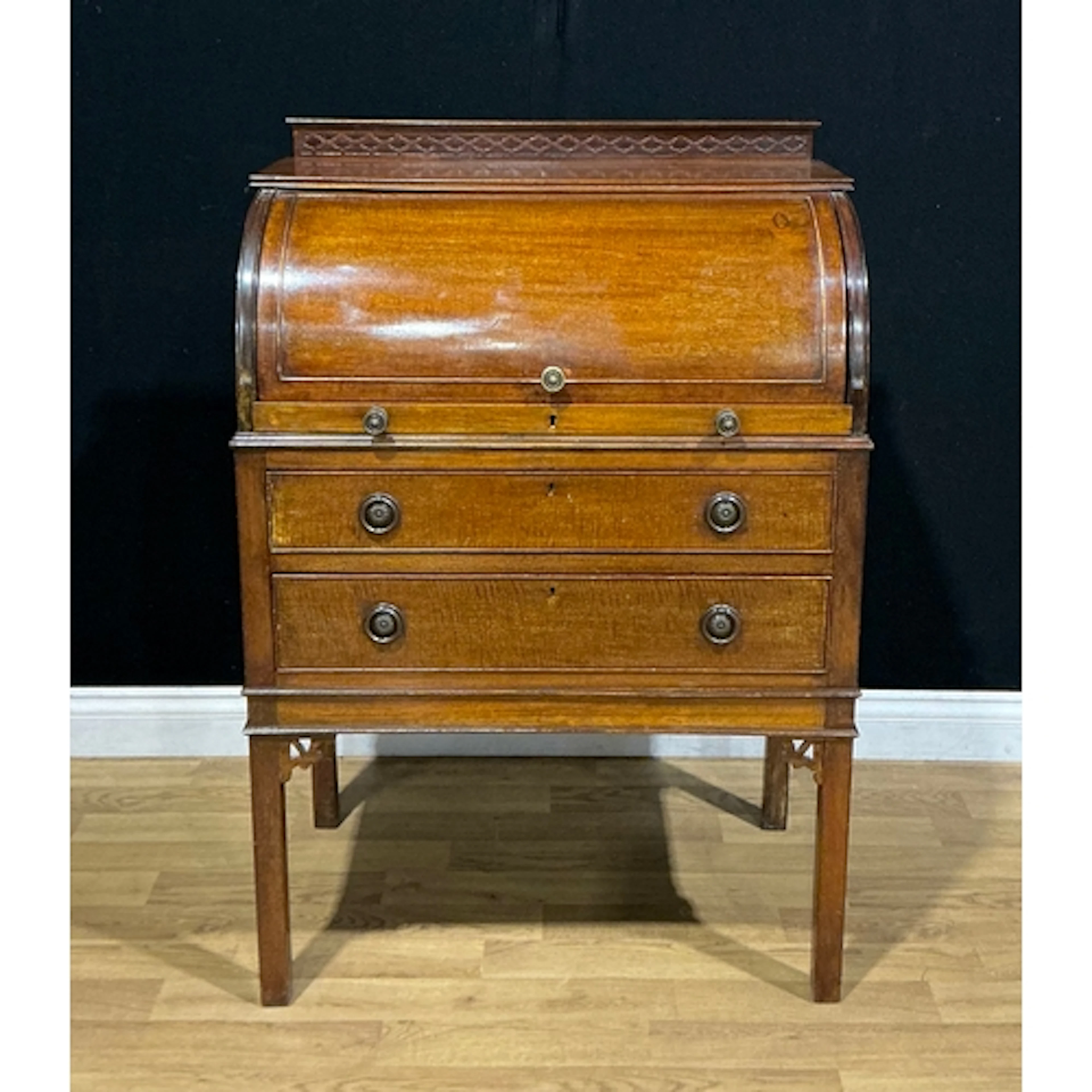 A Chippendale Revival mahogany cylinder desk, blind-fretwork...