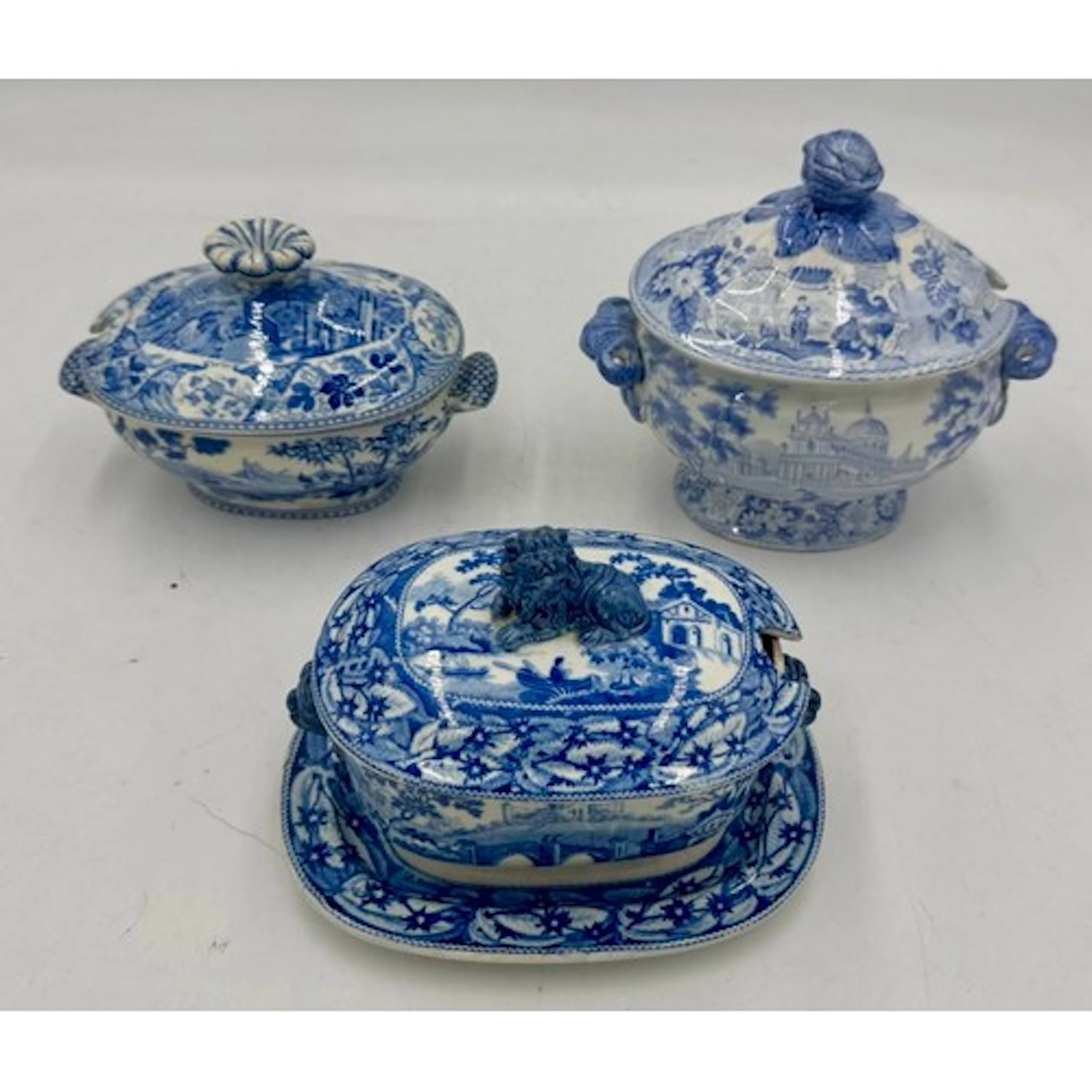 Three early 19th century blue and white transfer-printed sau...