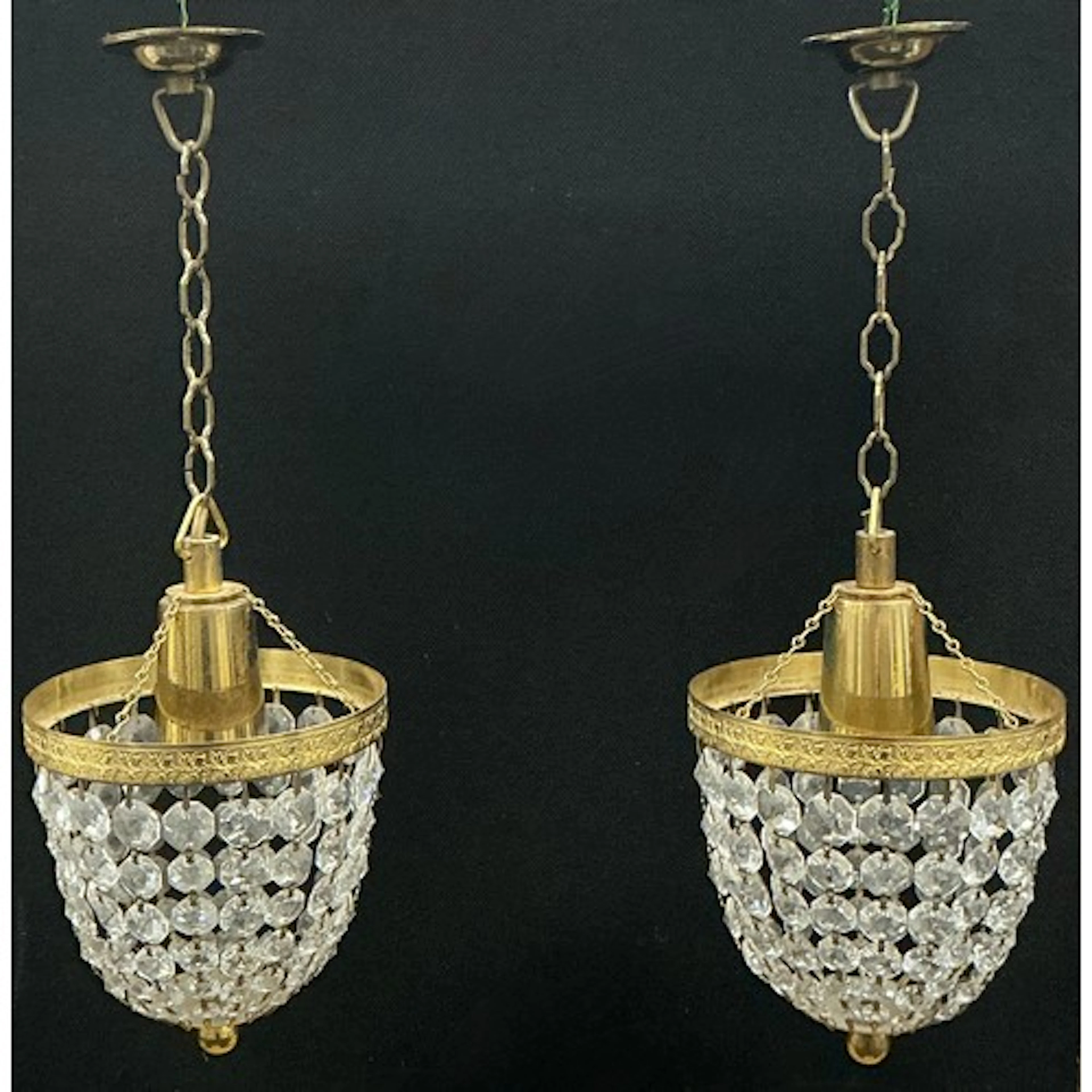 A pair of gilt metal and multi-strand bead pendant light cha...