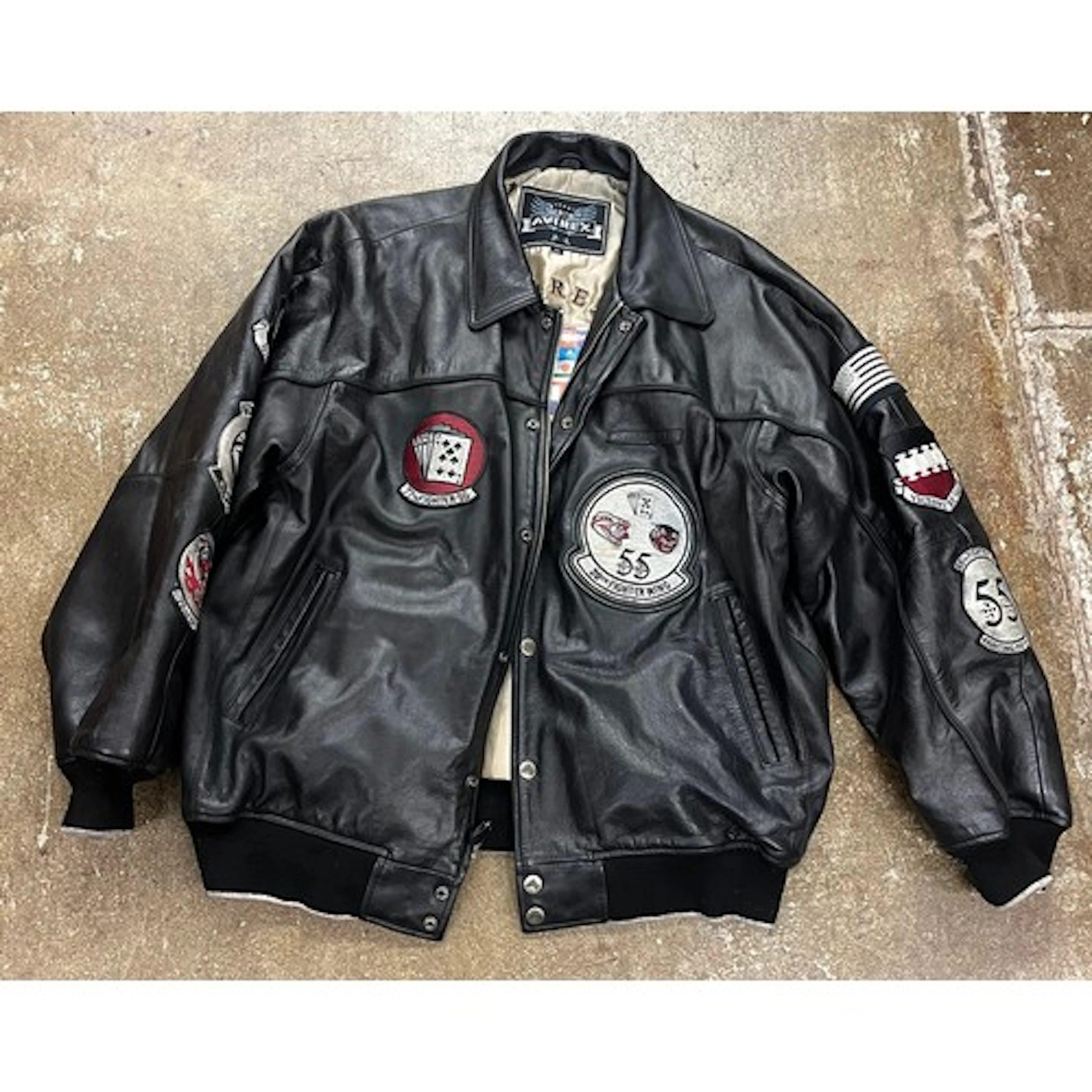 Leather Avirex jacket, size XL, with assorted patches.