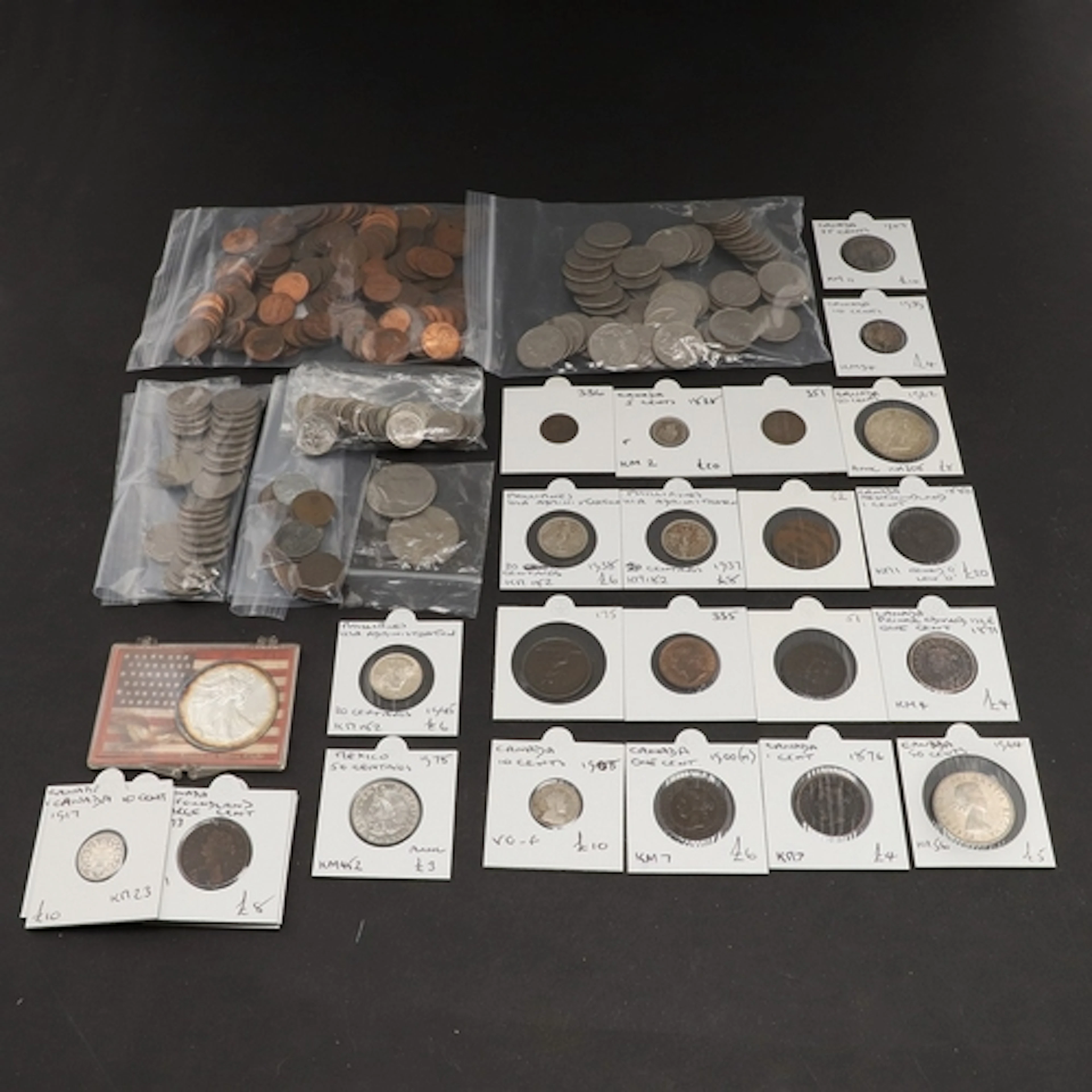 A COLLECTION OF WORLD COINS: USA, CANADA AND OTHER COUNTRIES...
