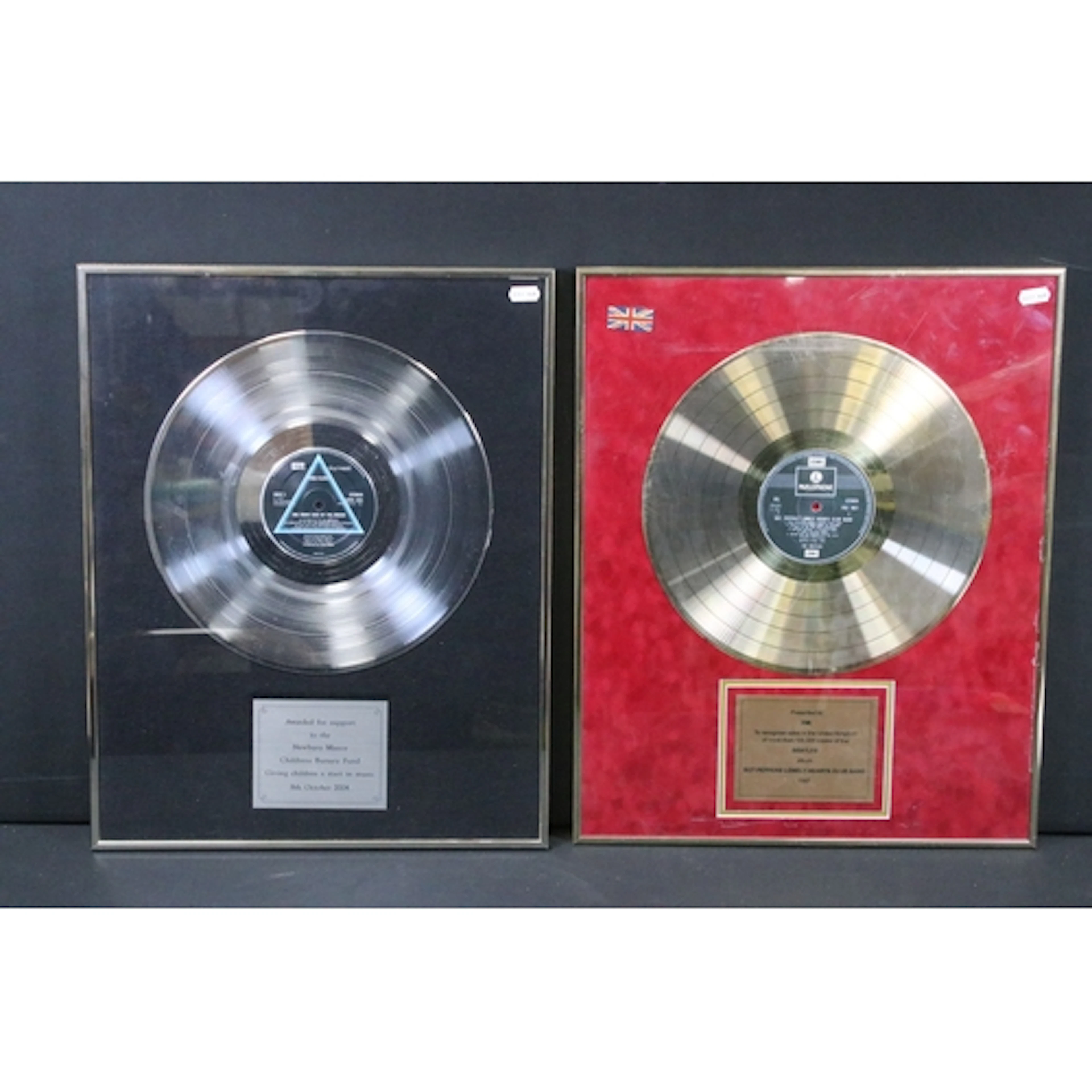 Memorabilia - Two framed and glazed presentation discs to in...