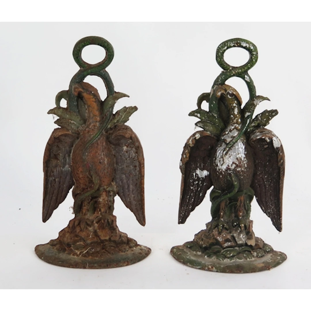 A pair of cast iron doorstops in the form of exotic birds, 3...