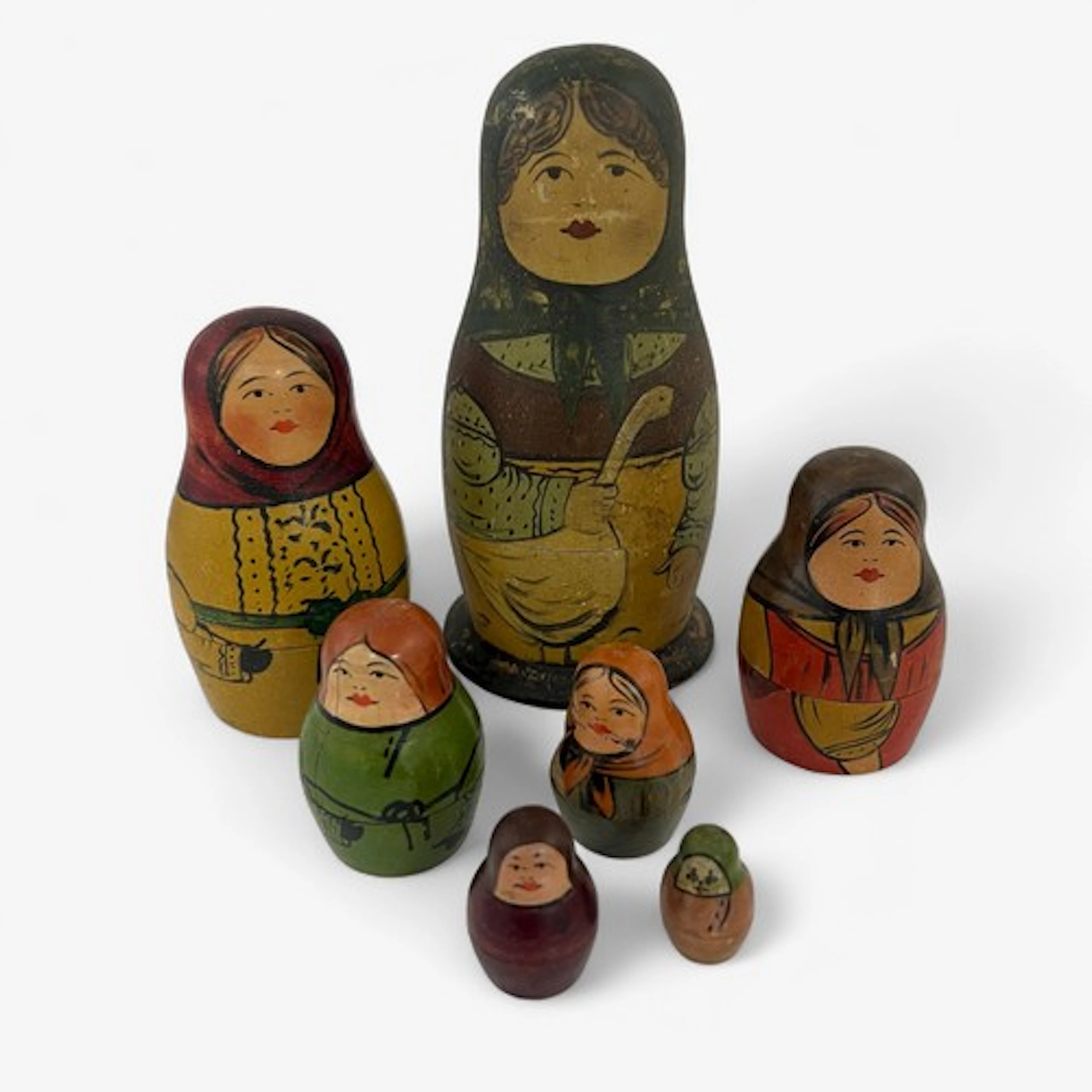 Early 20th Century Russian doll with seven figures in total....