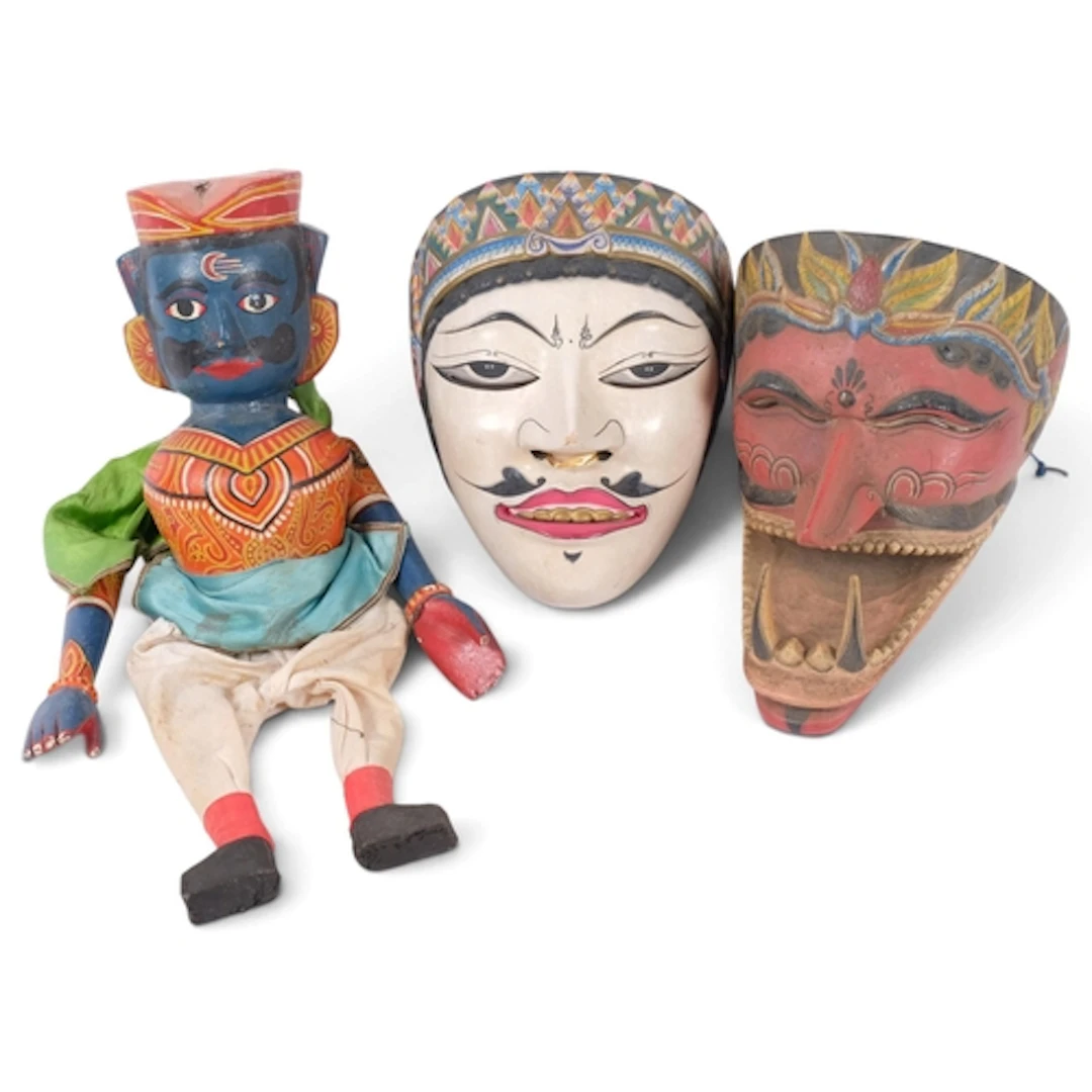 2 South East Asian carved and painted wood masks, and an Ind...