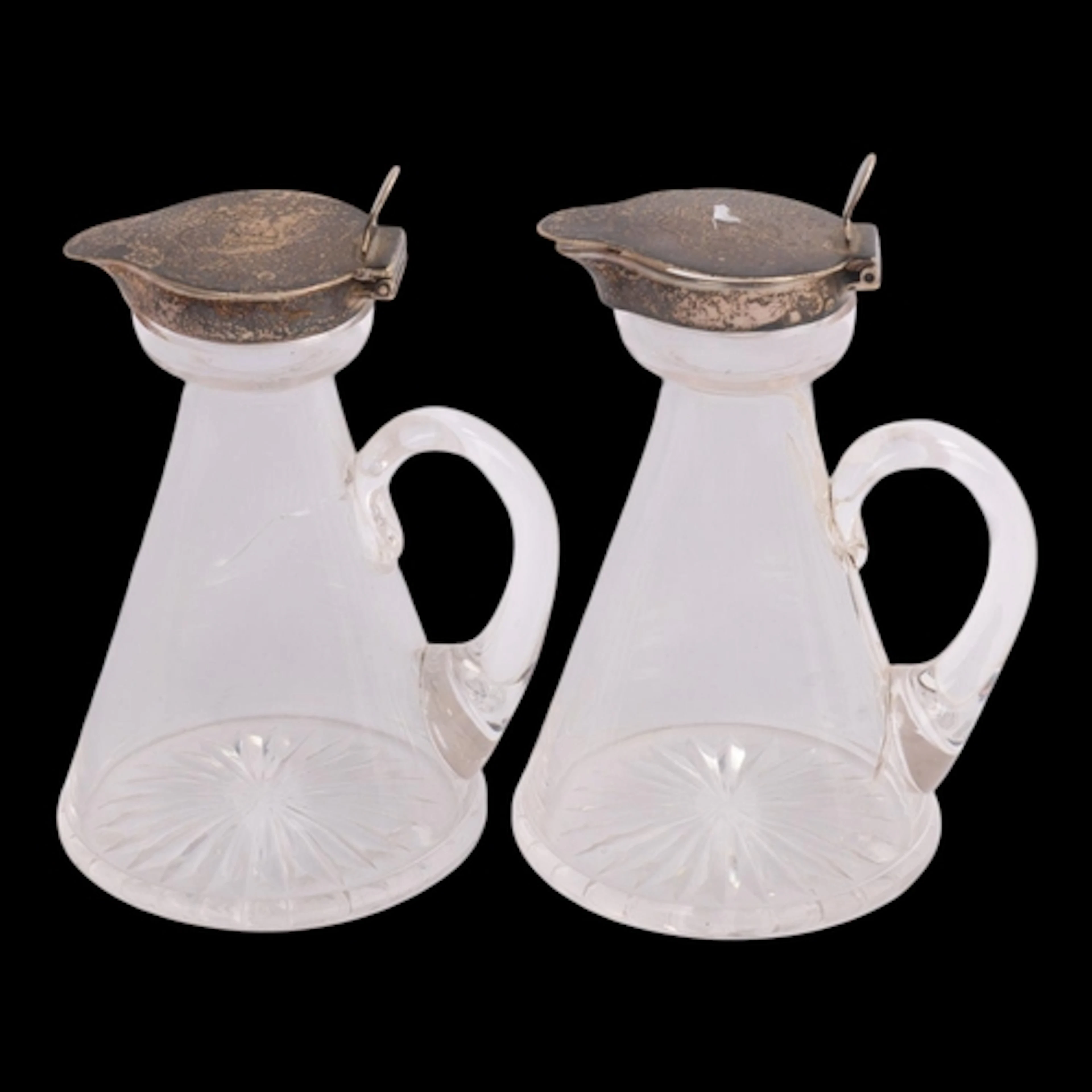 A pair of Edwardian silver-mounted glass Whisky noggins (bot...