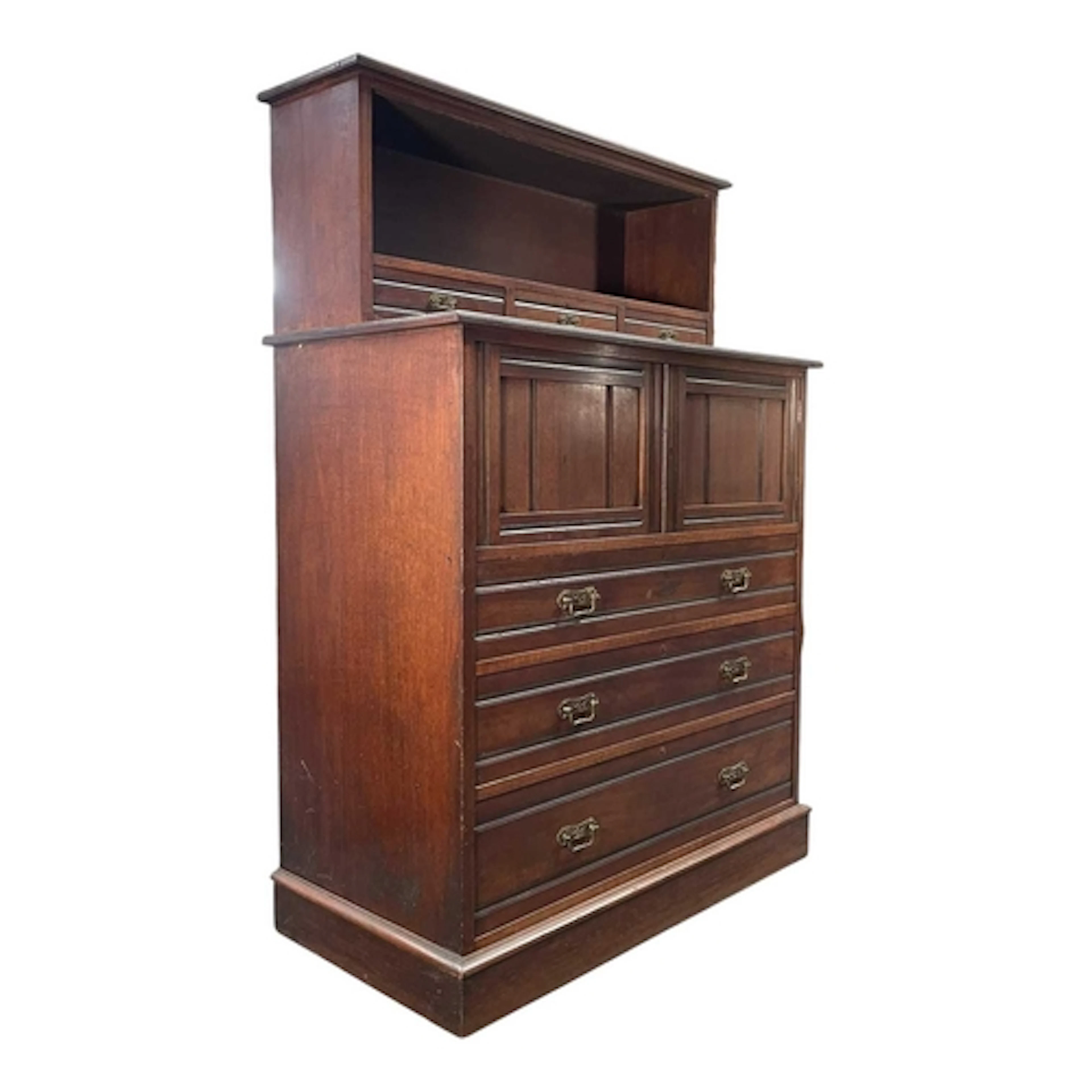 An Edwardian walnut chest of drawers cabinet by E. Beaman of...