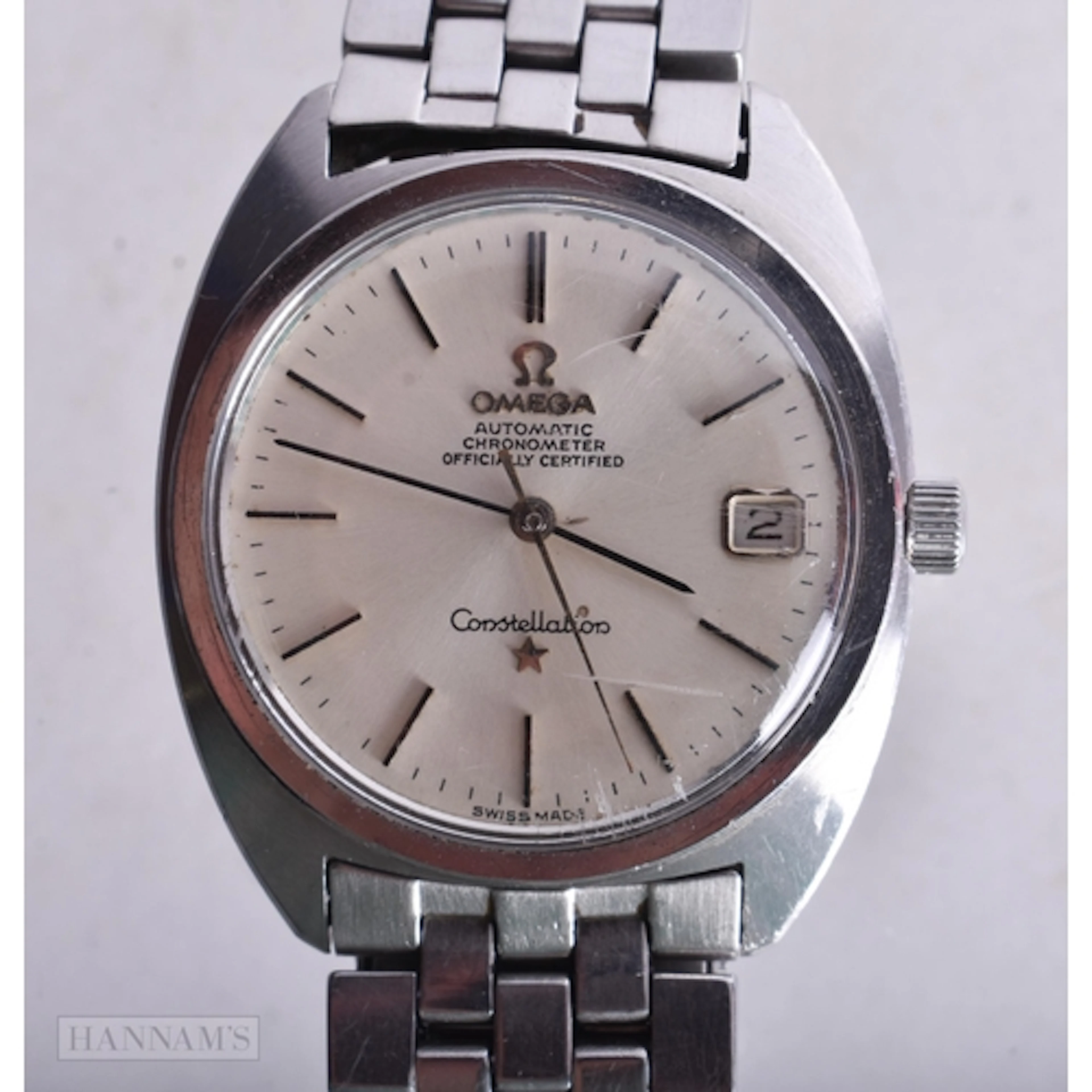 AN OMEGA CONSTELLATION WRIST WATCH. Running. 3.5 cm wide.