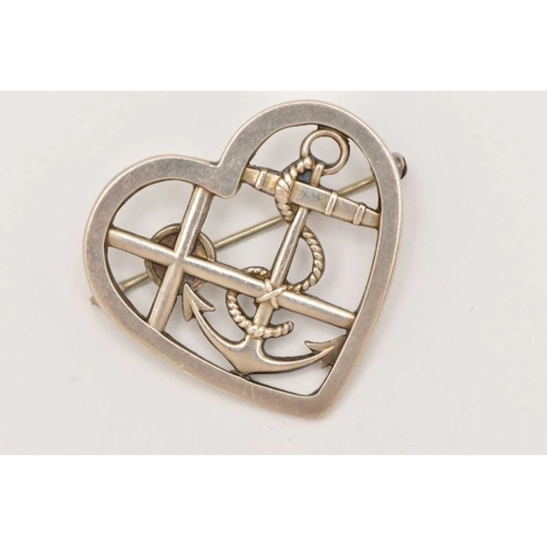 A 'GEORG JENSEN' BROOCH, an open work 'faith, hope and chari...