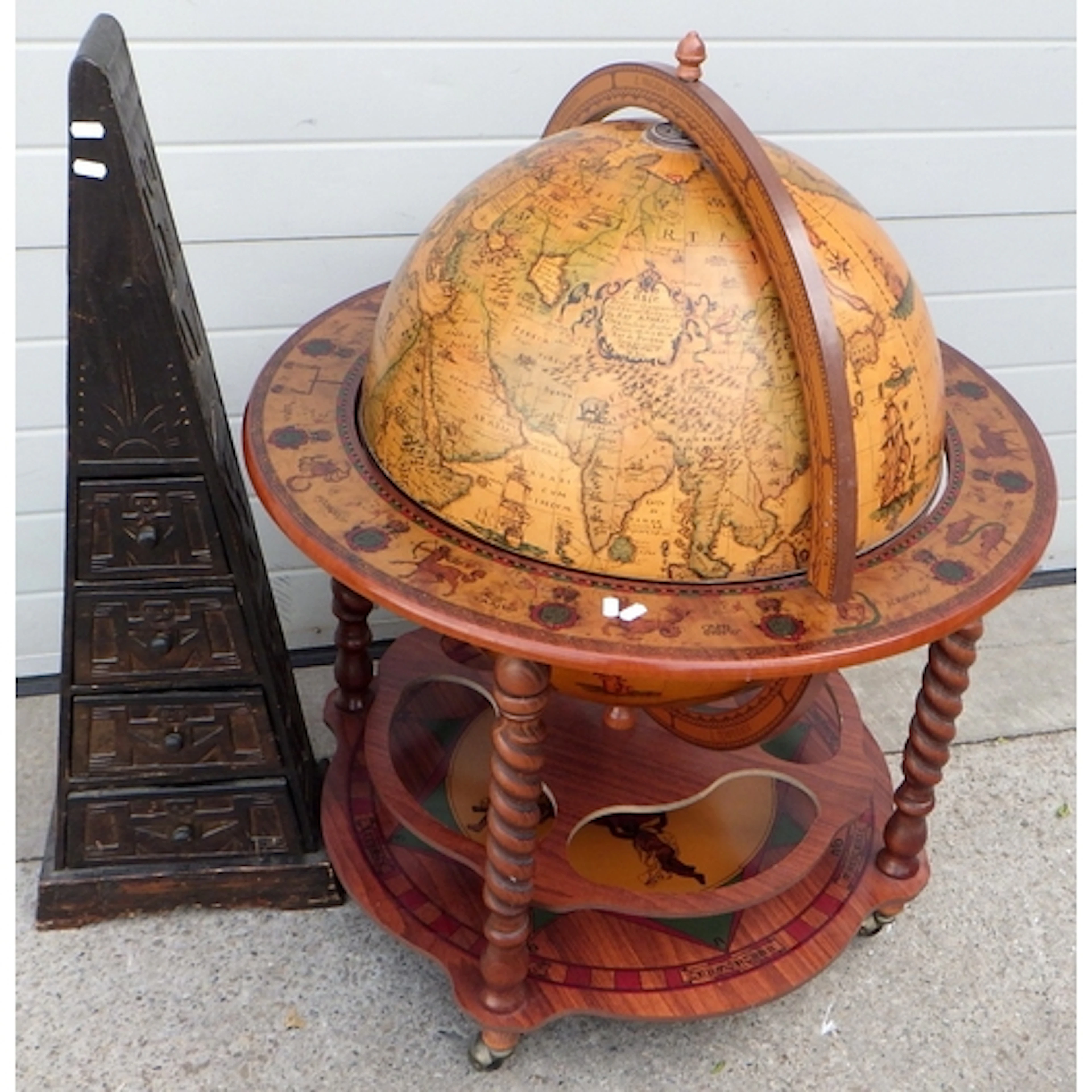 A large drinks globe, 101cm tall together with a n Aztec sty...