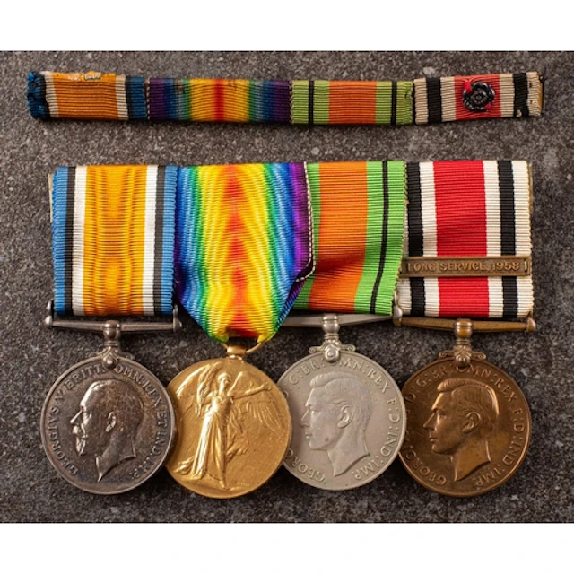 A WWI/WWII group of four to '47961 Pte W Bromley Manch R' Wa...