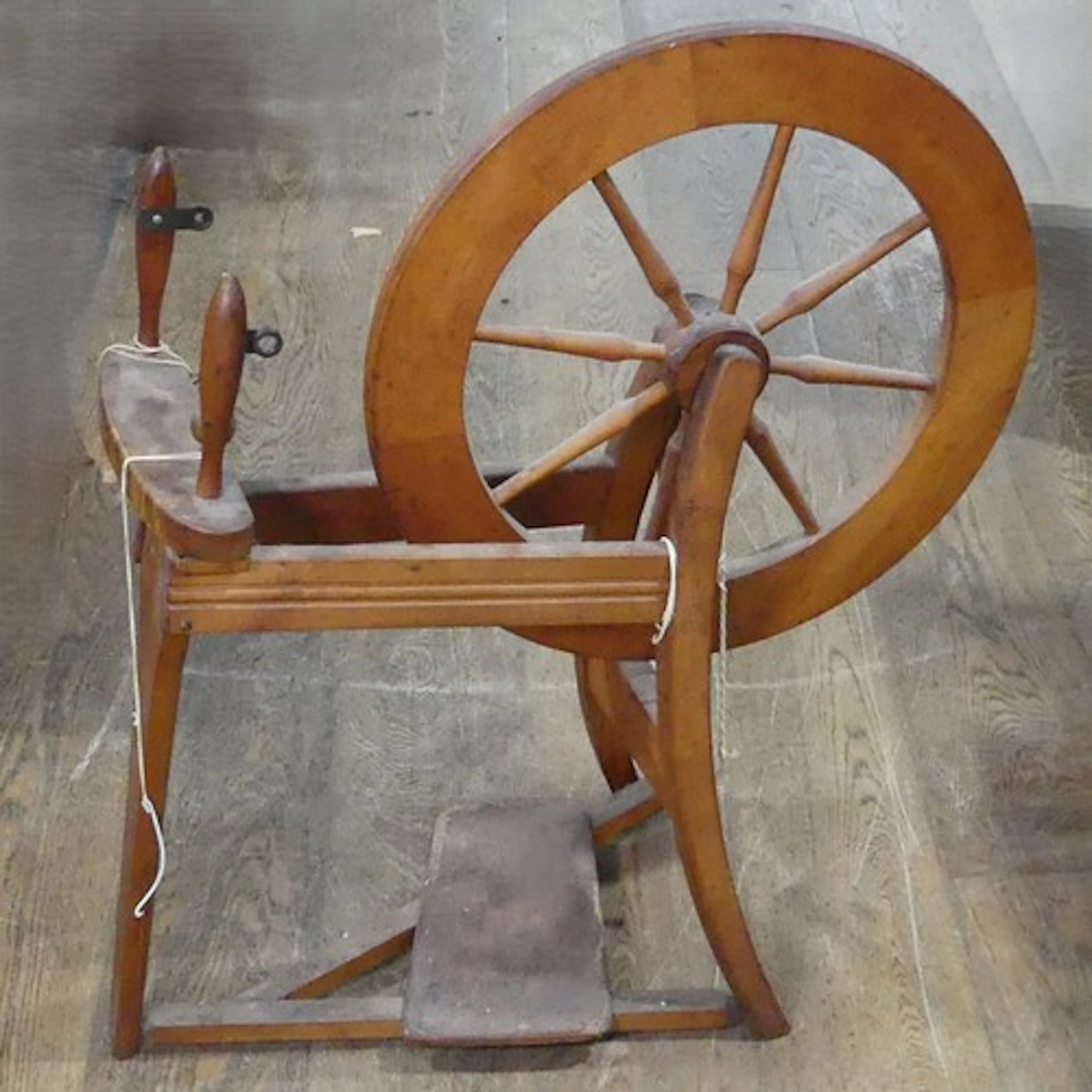 Three antique spinning Wheels, including one early painted e...