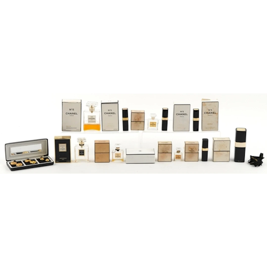 Collection of Chanel No. 5 empty perfume bottles and boxes t...