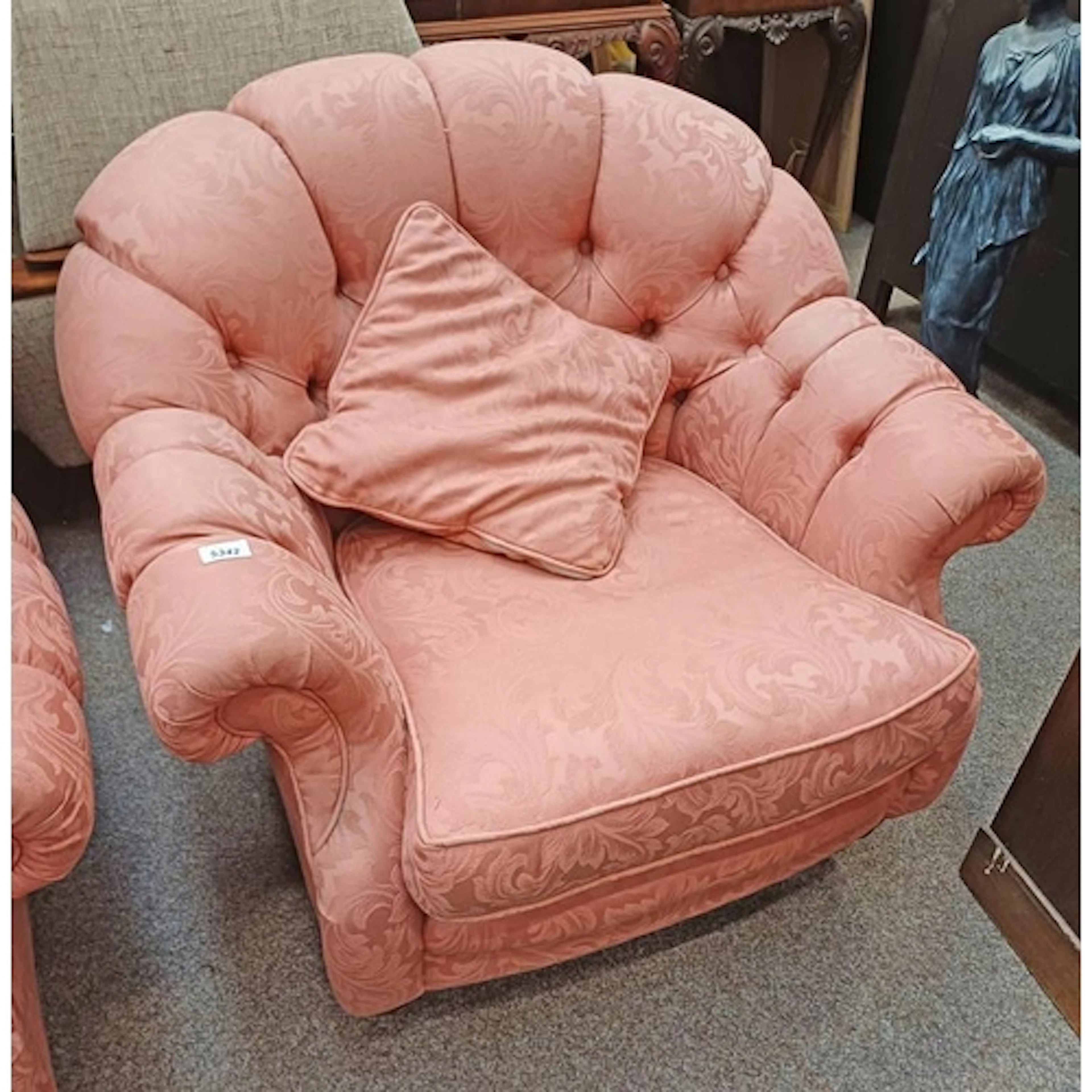 OVERSTUFFED ARMCHAIR WITH PINK FOLIAGE PATTERN LABELLED LINC...