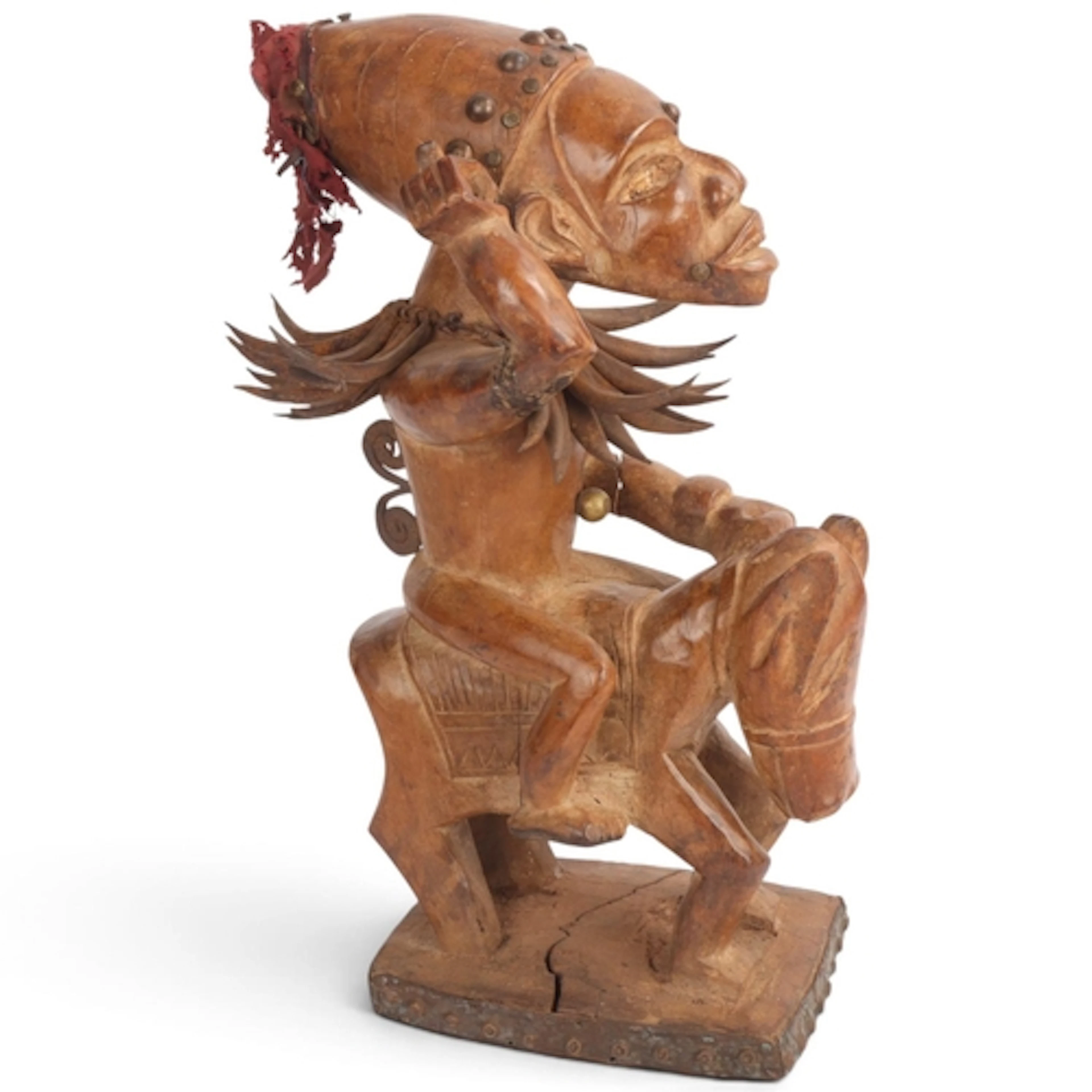 A Yoruba horse and rider, Nigeria, carved wood, height 35cm