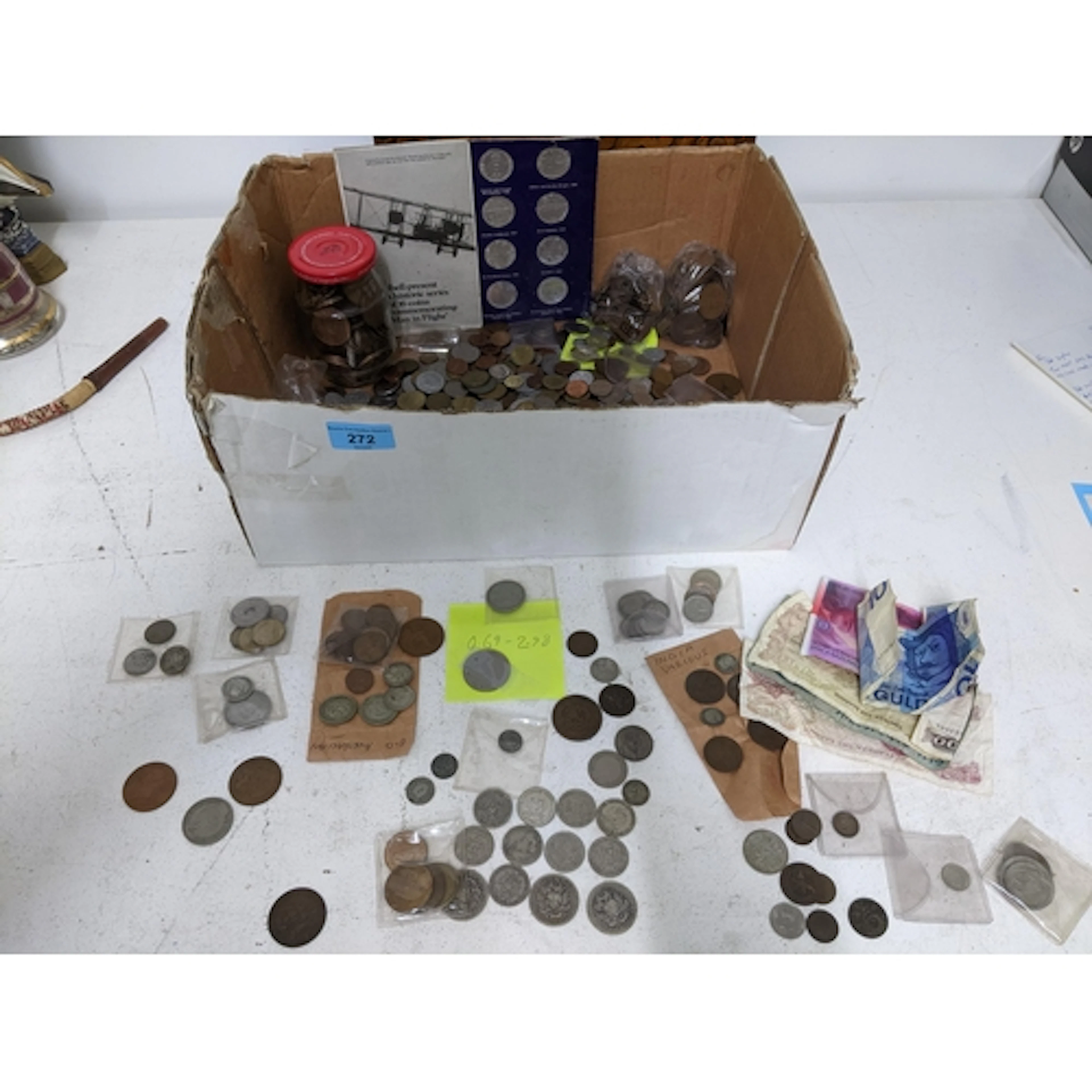 A selection of world coins to include Chinese, India, and Ve...