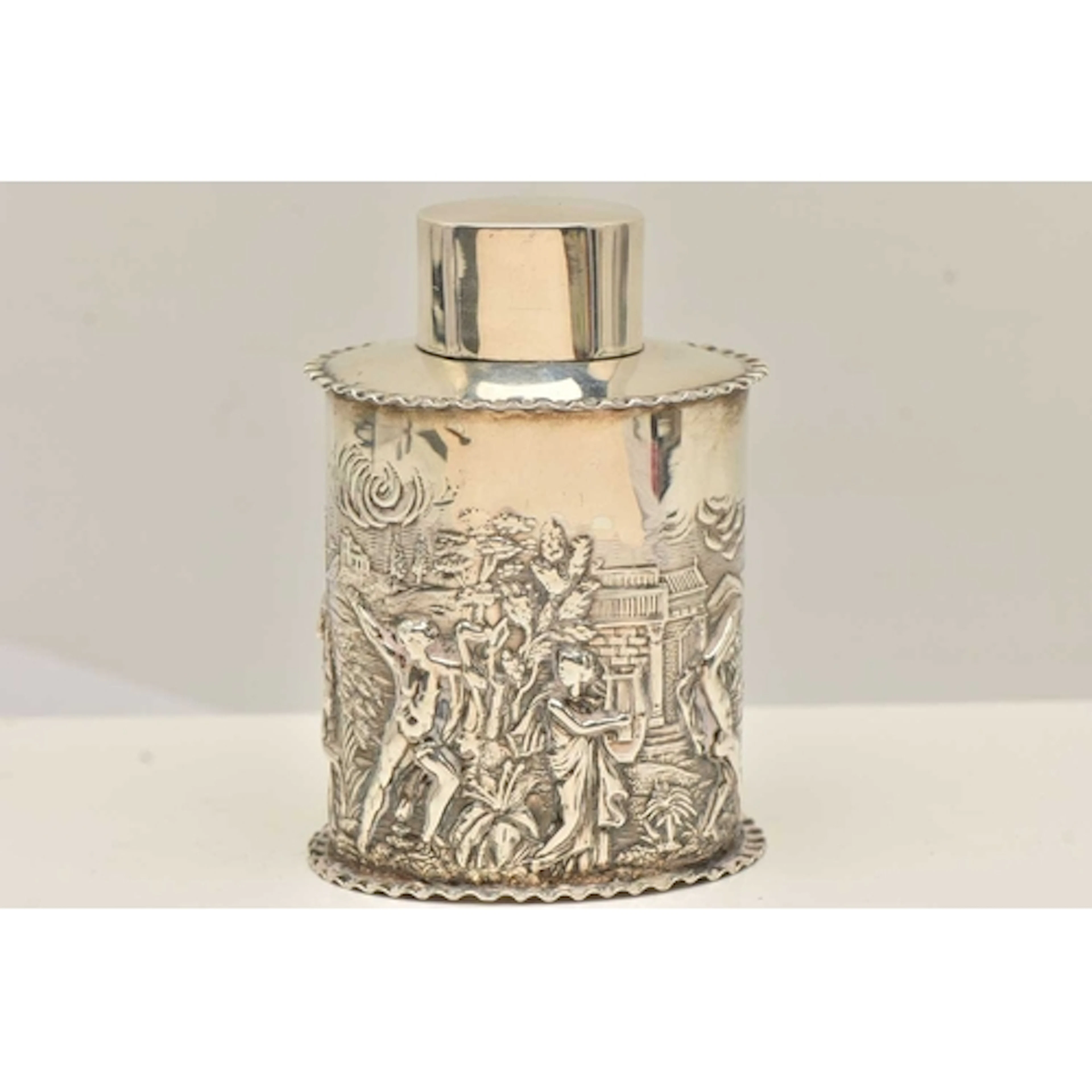 A VICTORIA SILVER TEA CADDY, an oval form caddy, depicting a...