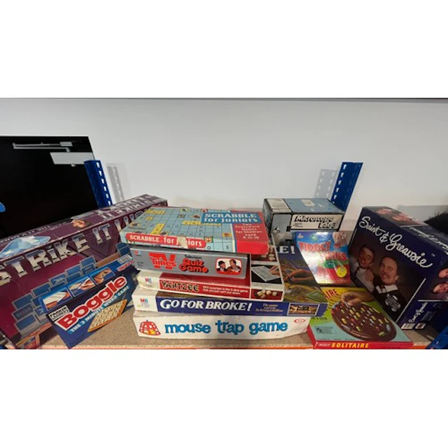 Shelf containing board games to include Mouse Trap, Strike i...