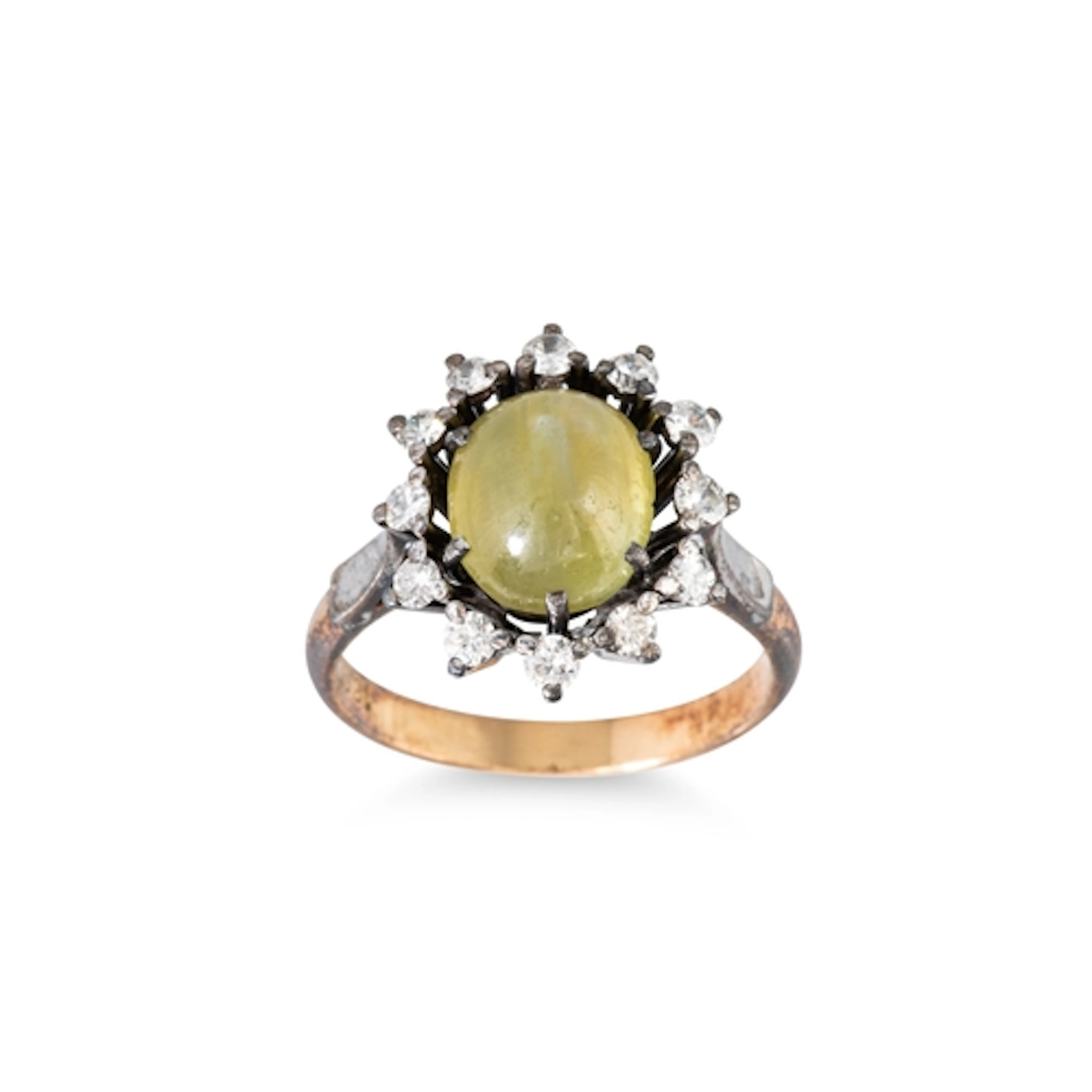 A VINTAGE CAT'S EYE CHRYSOBERYL AND DIAMOND CLUSTER RING, mo...