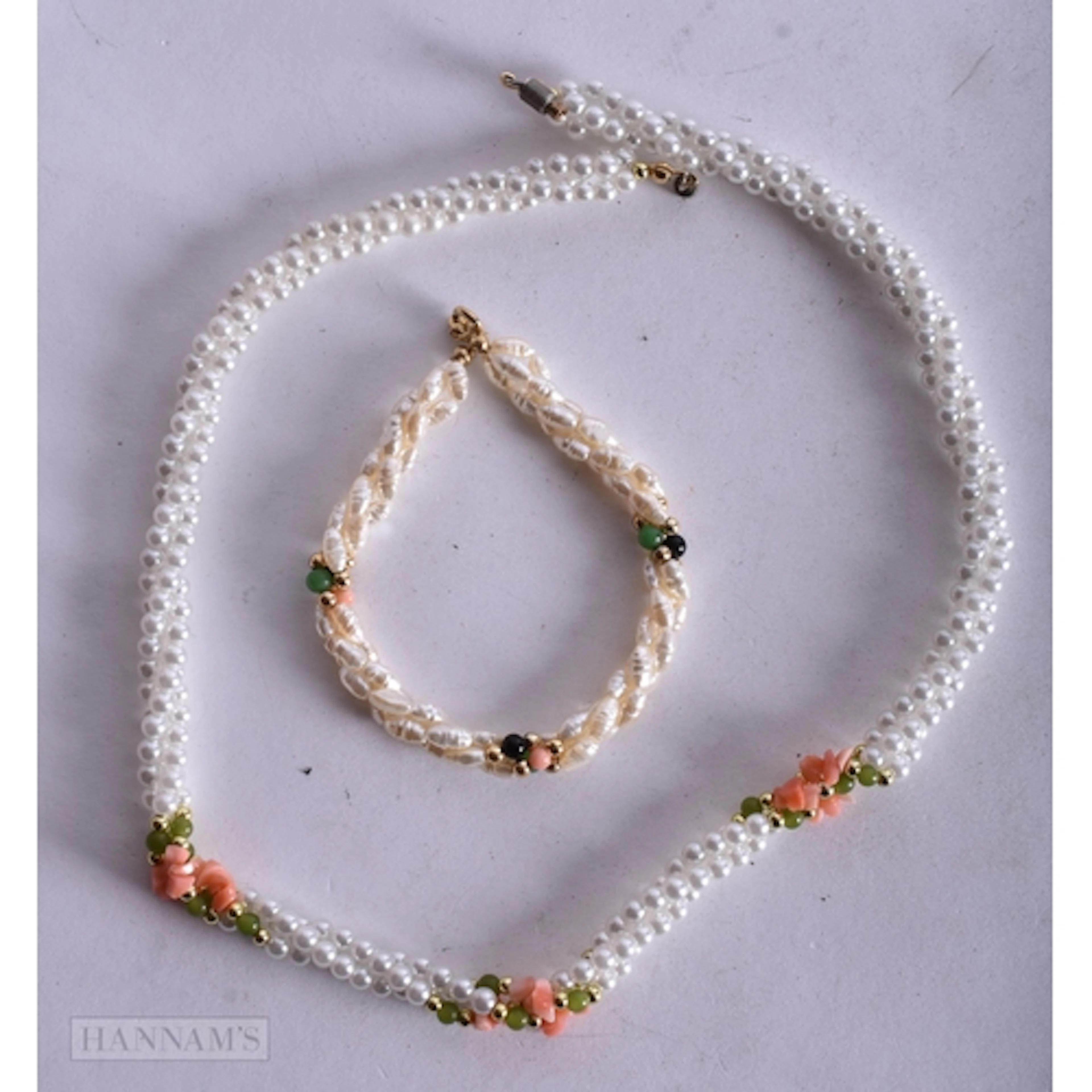 A PEARL AND CORAL NECKLACE together with a similar bracelet....