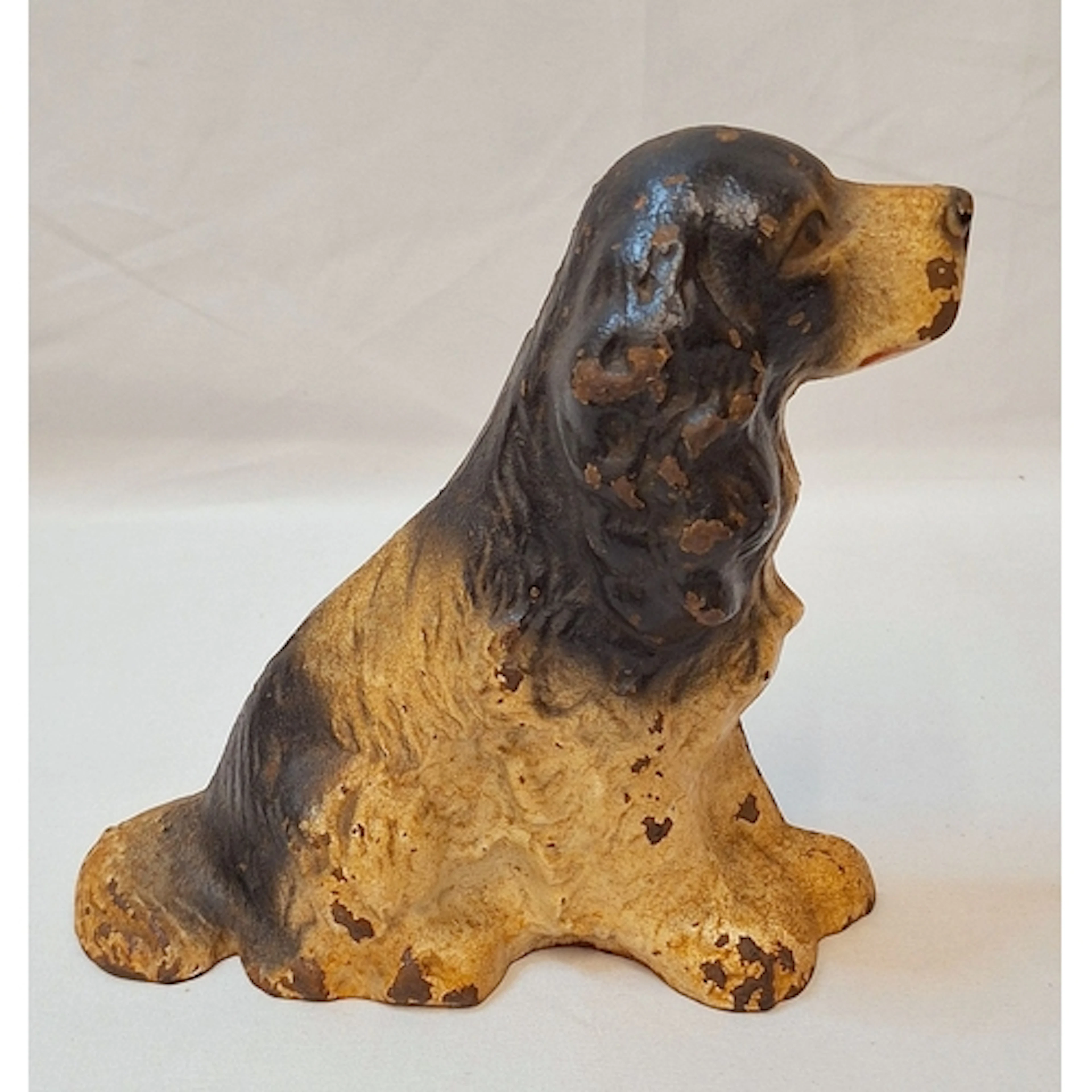 Vintage Cast Iron Doorstop in the form of a black & white sp...