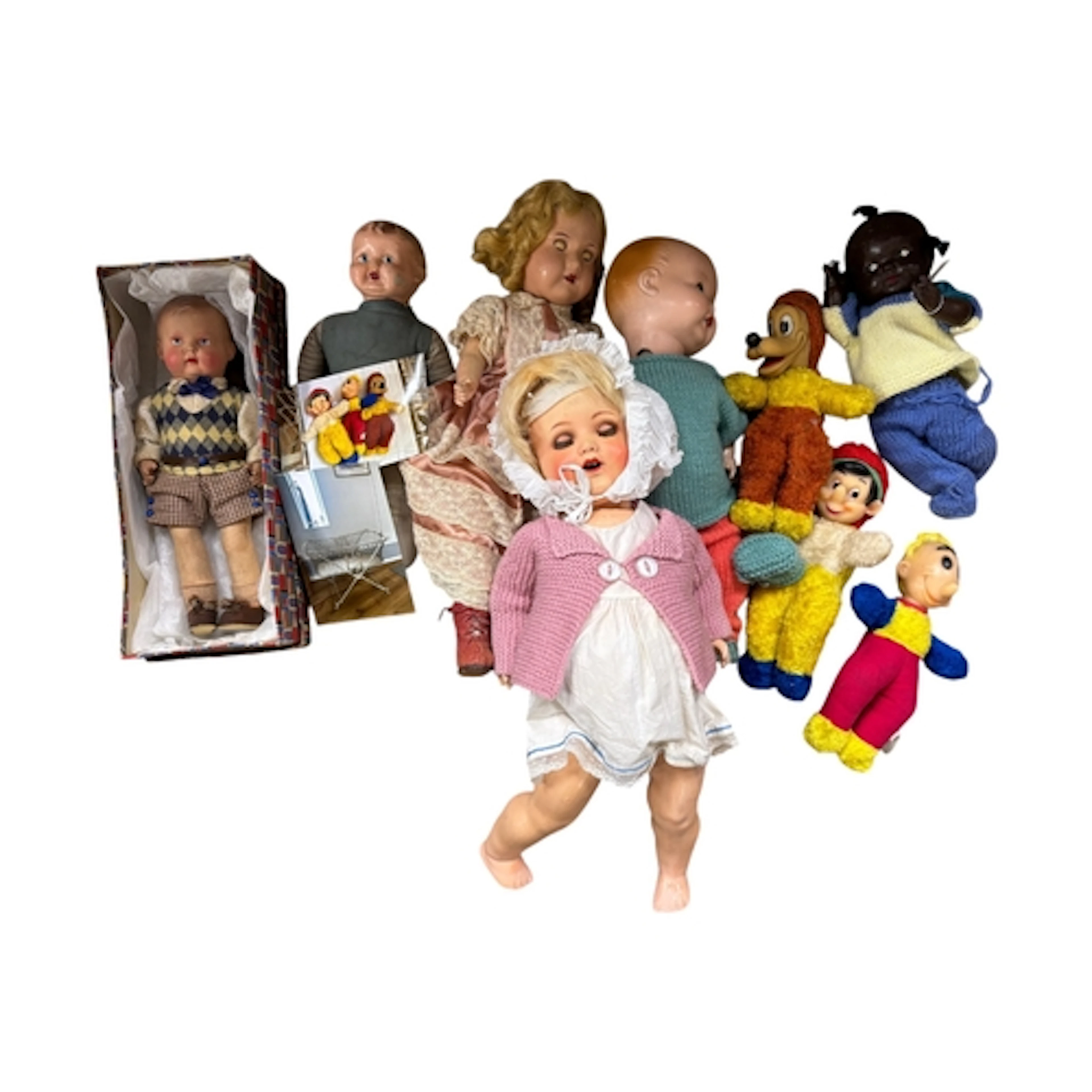 Six dolls including a boxed model of a boy with celluloid he...