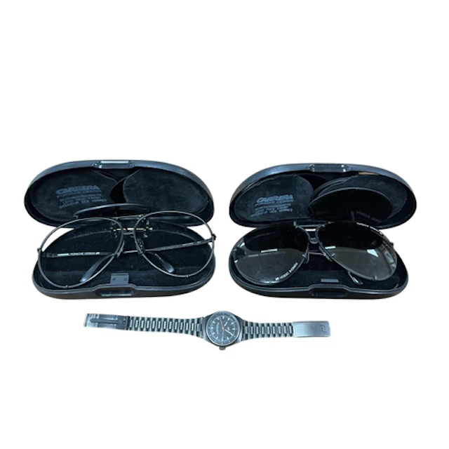 A Porsche design wrist watch, two pairs of Porsche sunglasse...