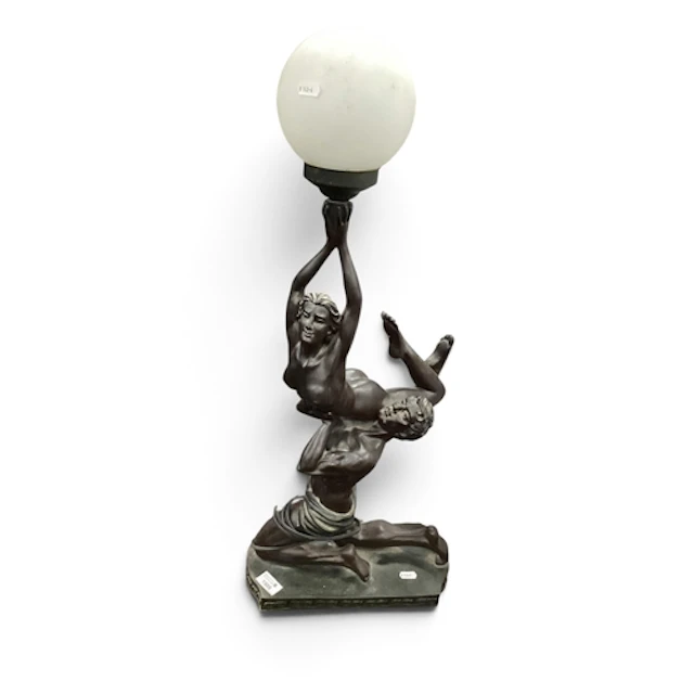 Ackerman Art Deco-Style Figural Table Lamp, depicting a male...