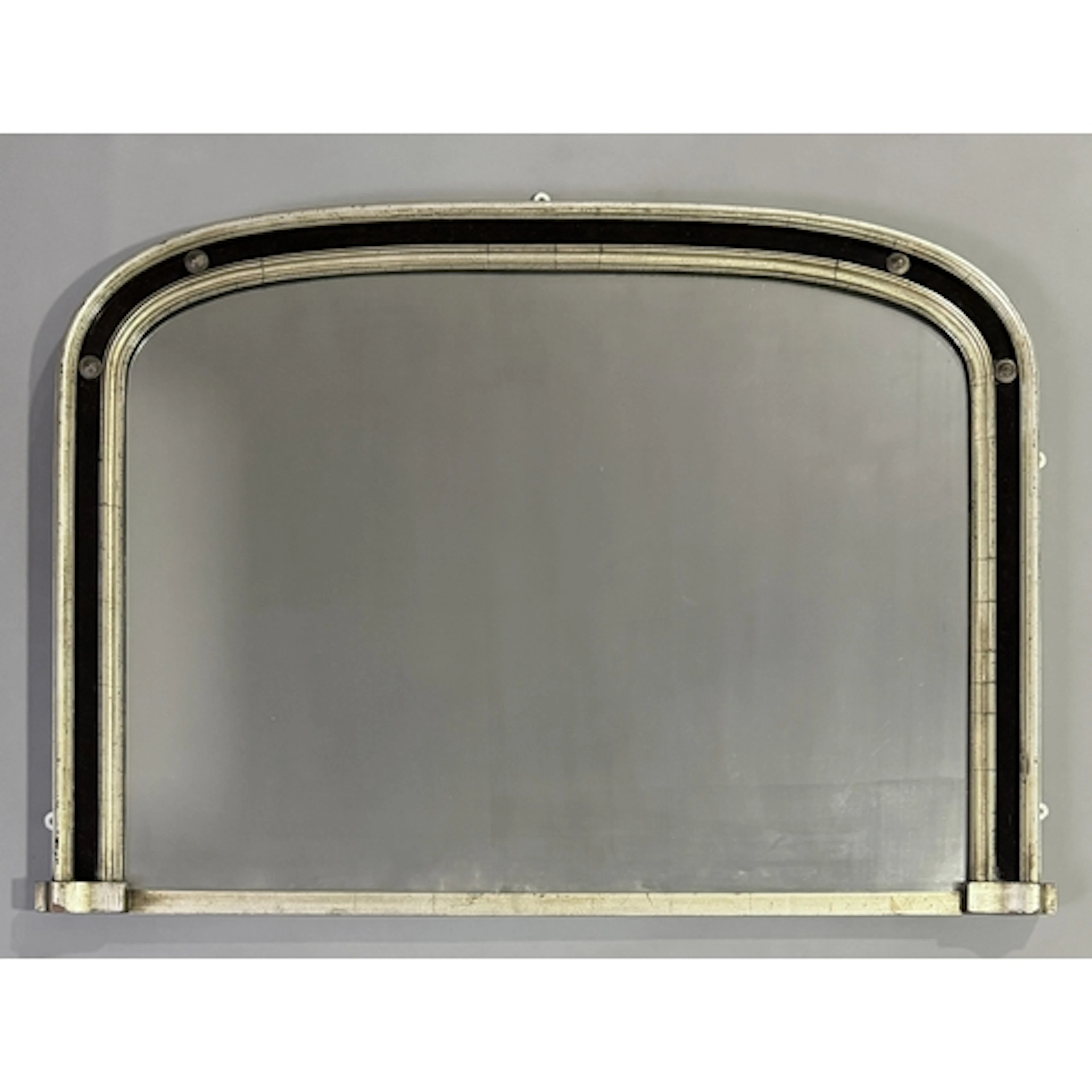 A Victorian silvered and black glass arched overmantel mirro...