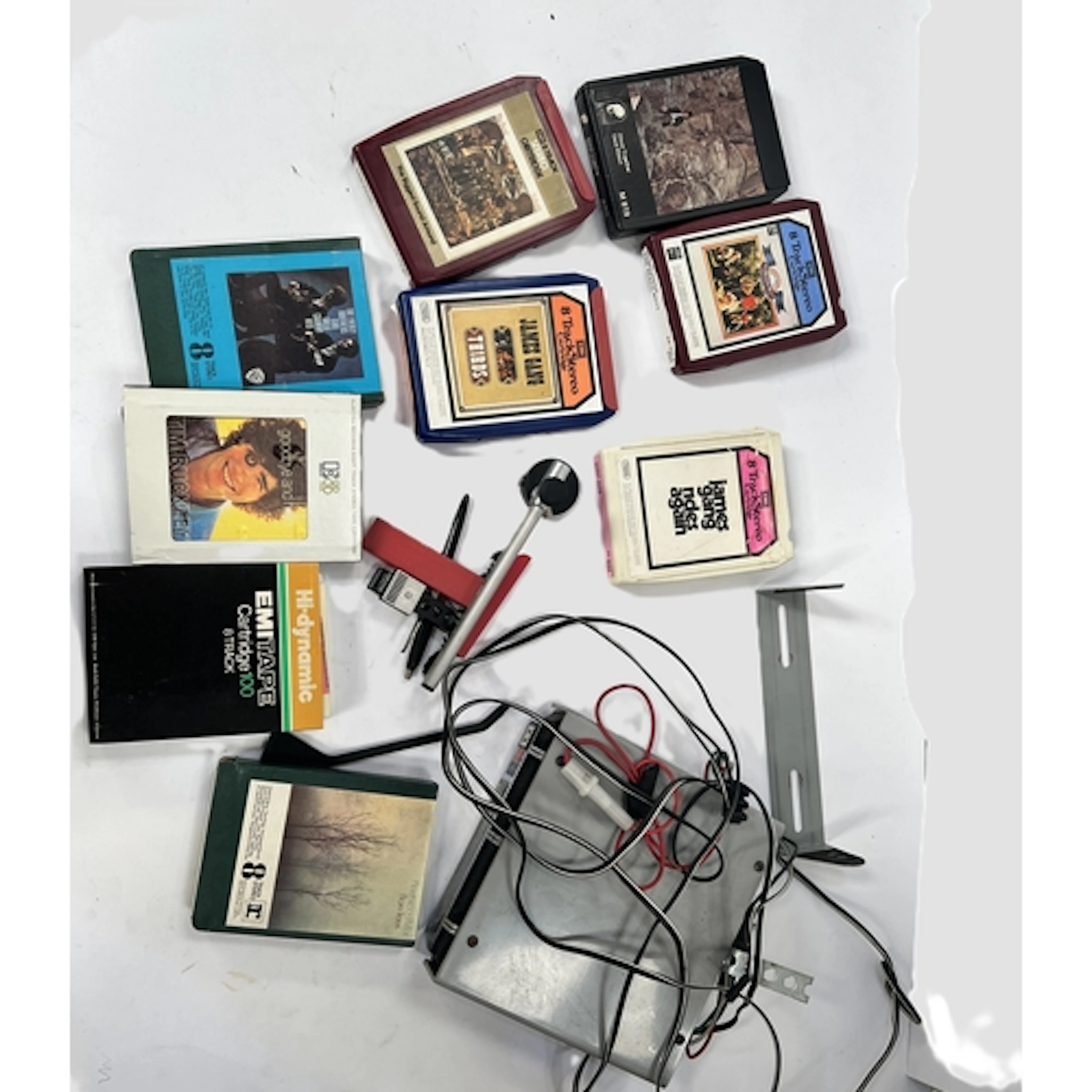 A vintage 8-track car player and tapes including Fleetwood M...