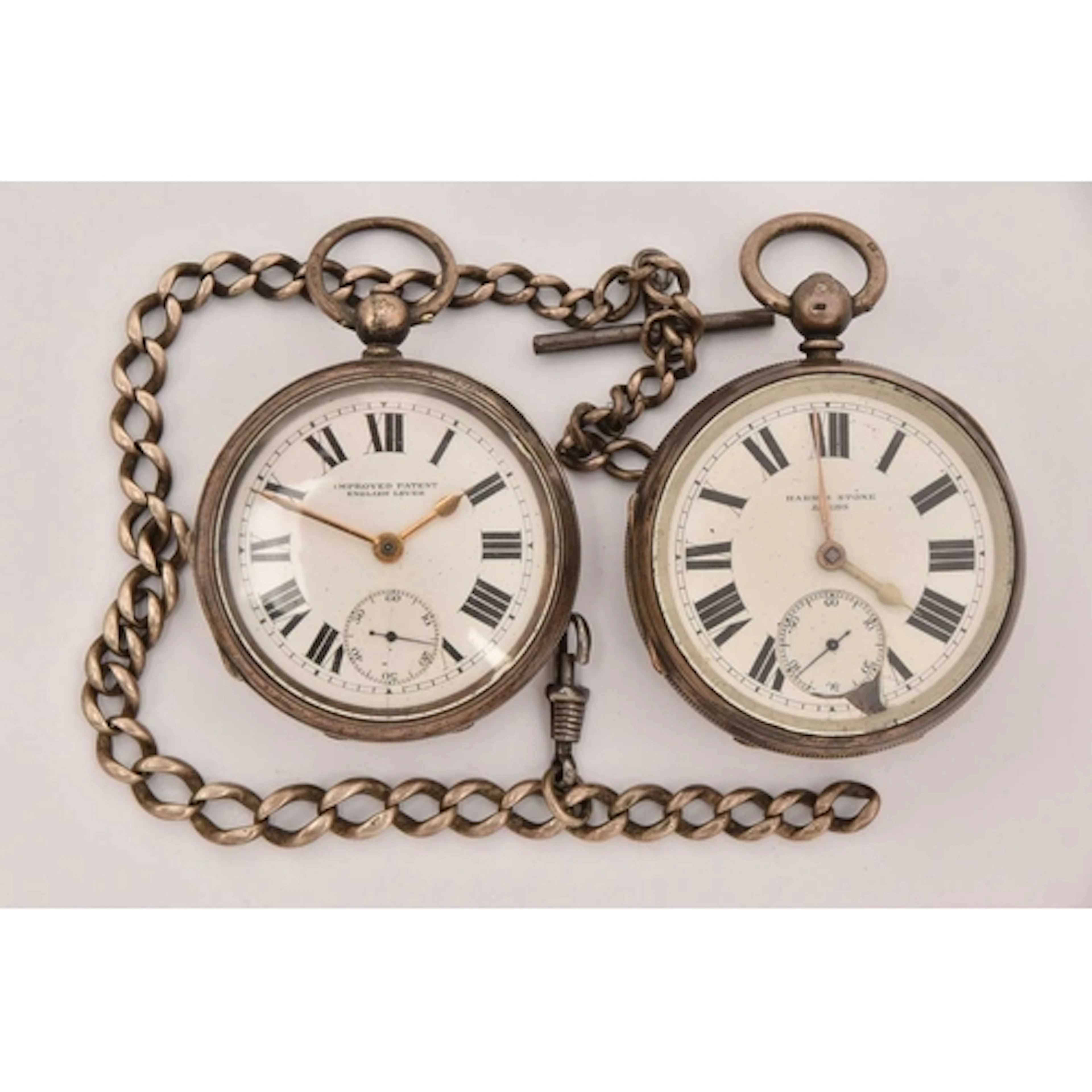 TWO SILVER OPEN FACE POCKET WATCHES AND AN ALBERT CHAIN, two...