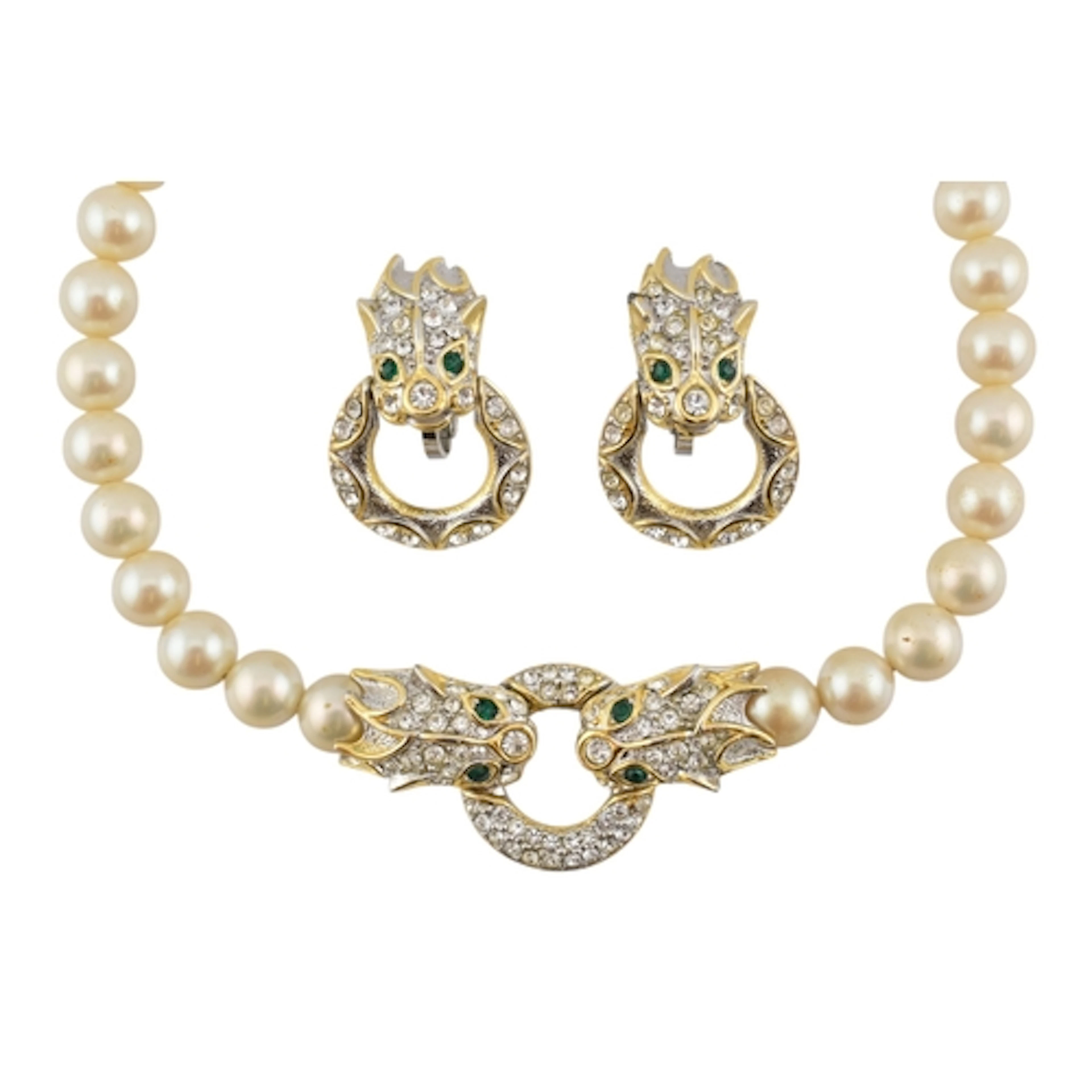 A faux pearl and gold tone dragon ring necklace and pair of ...