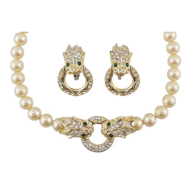 A faux pearl and gold tone dragon ring necklace and pair of ...