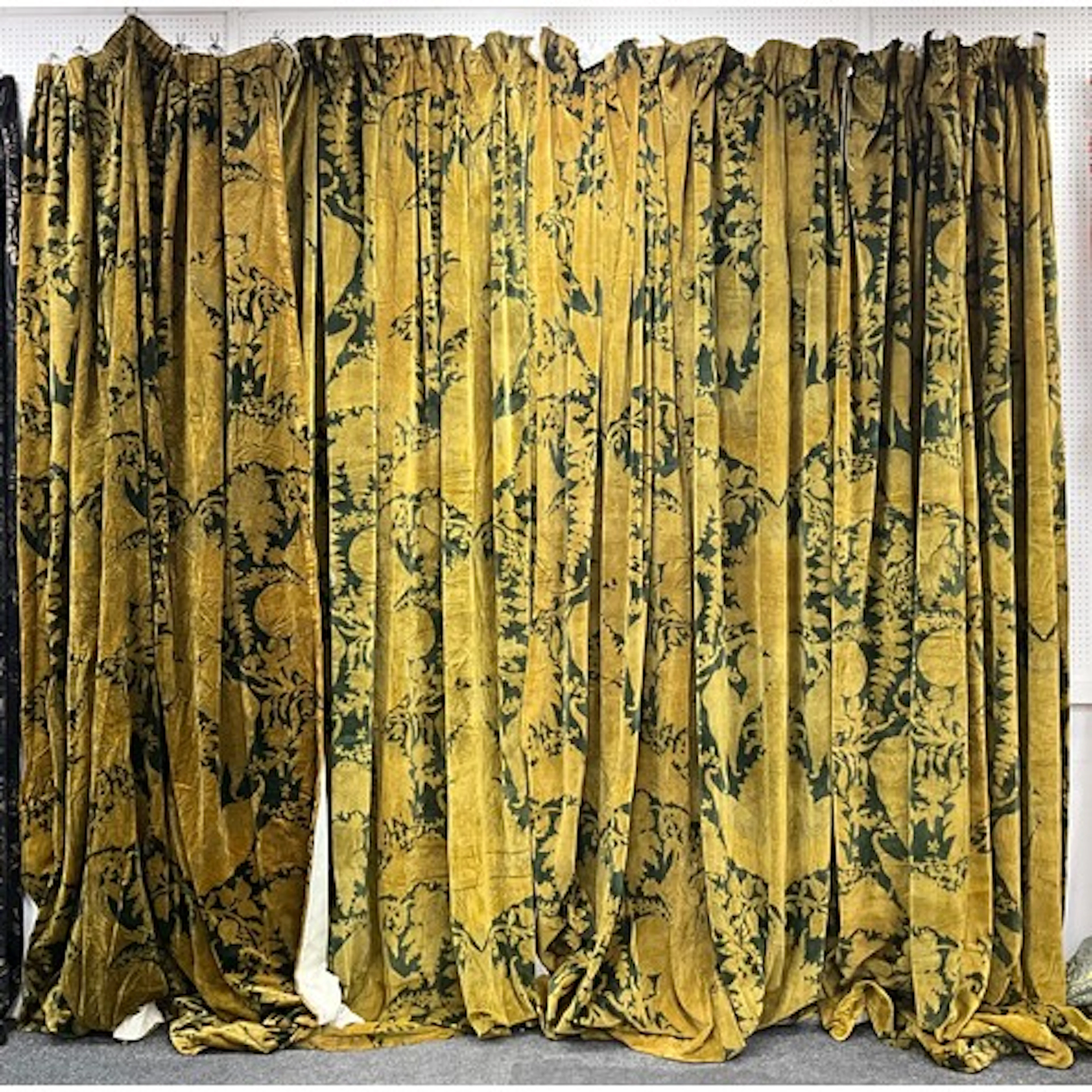 A suite of four green velvet full length curtains, foliate b...