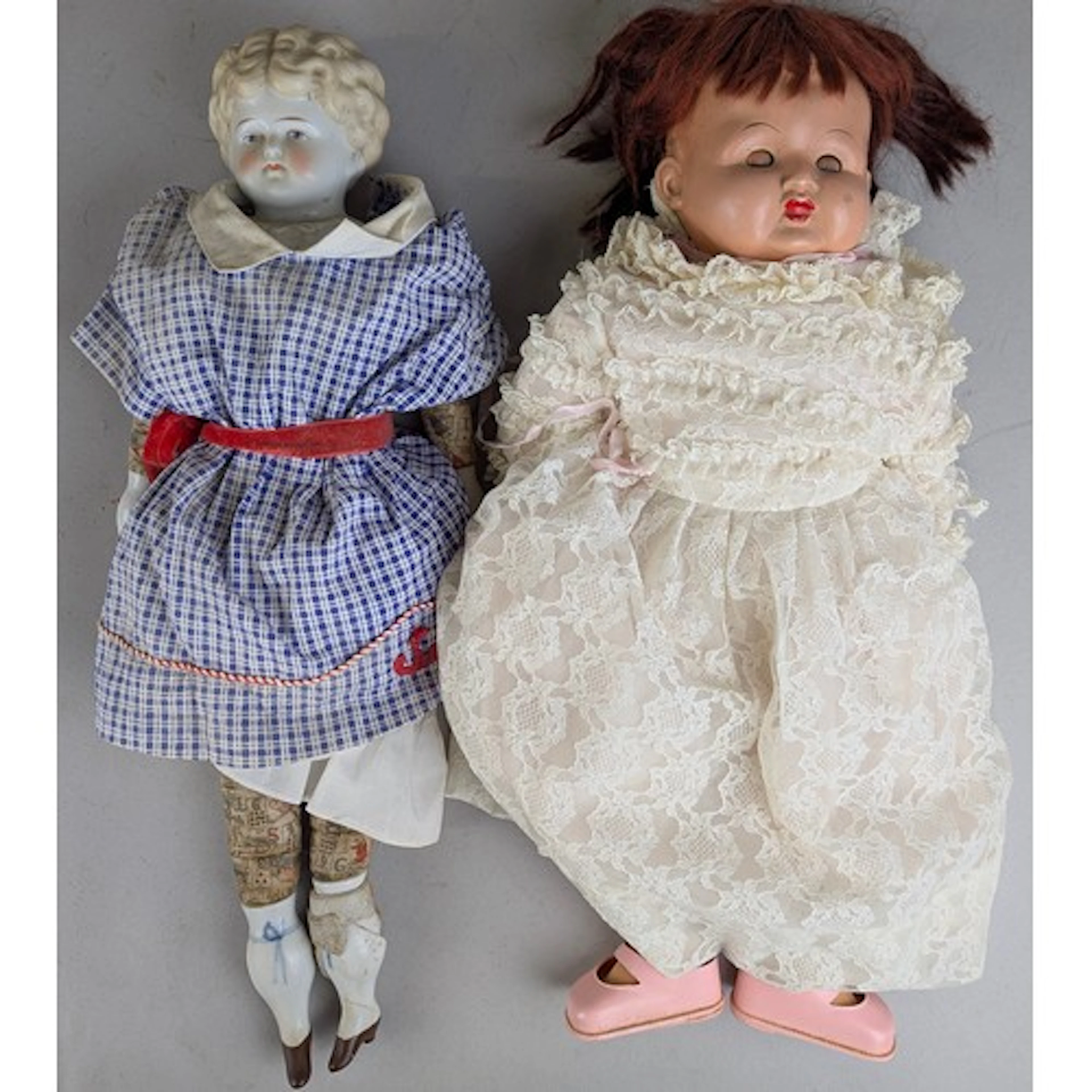 A German porcelain printed body shoulder head doll, probably...
