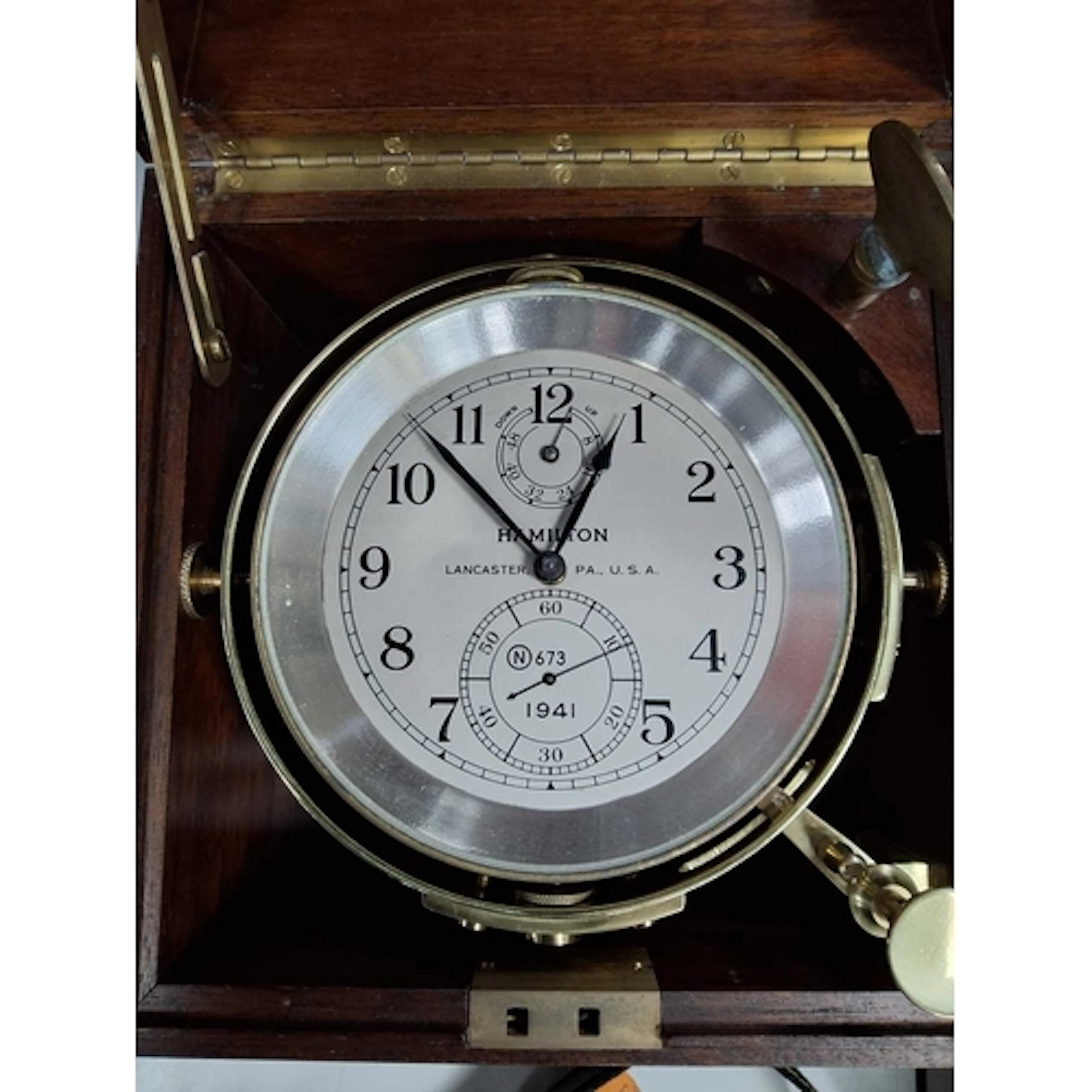 A HAMILTON MODEL 21 TWO-DAY MARINE CHRONOMETER, the silvered...