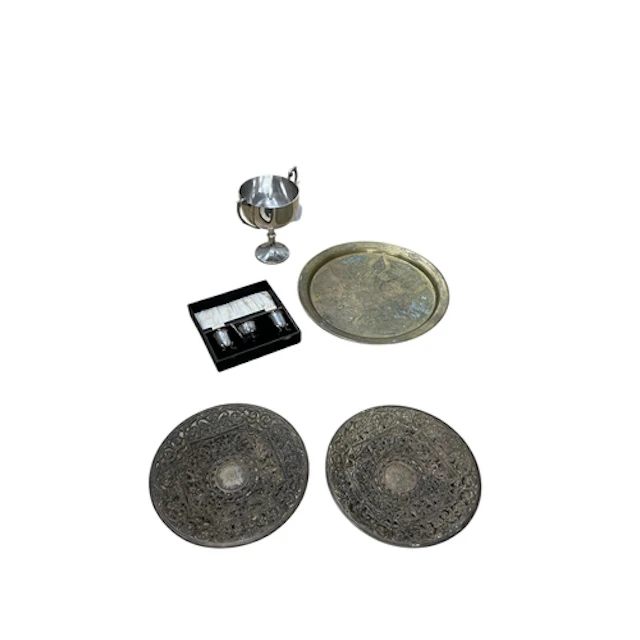 A mixed group of metalware comprising a Middle Eastern engra...