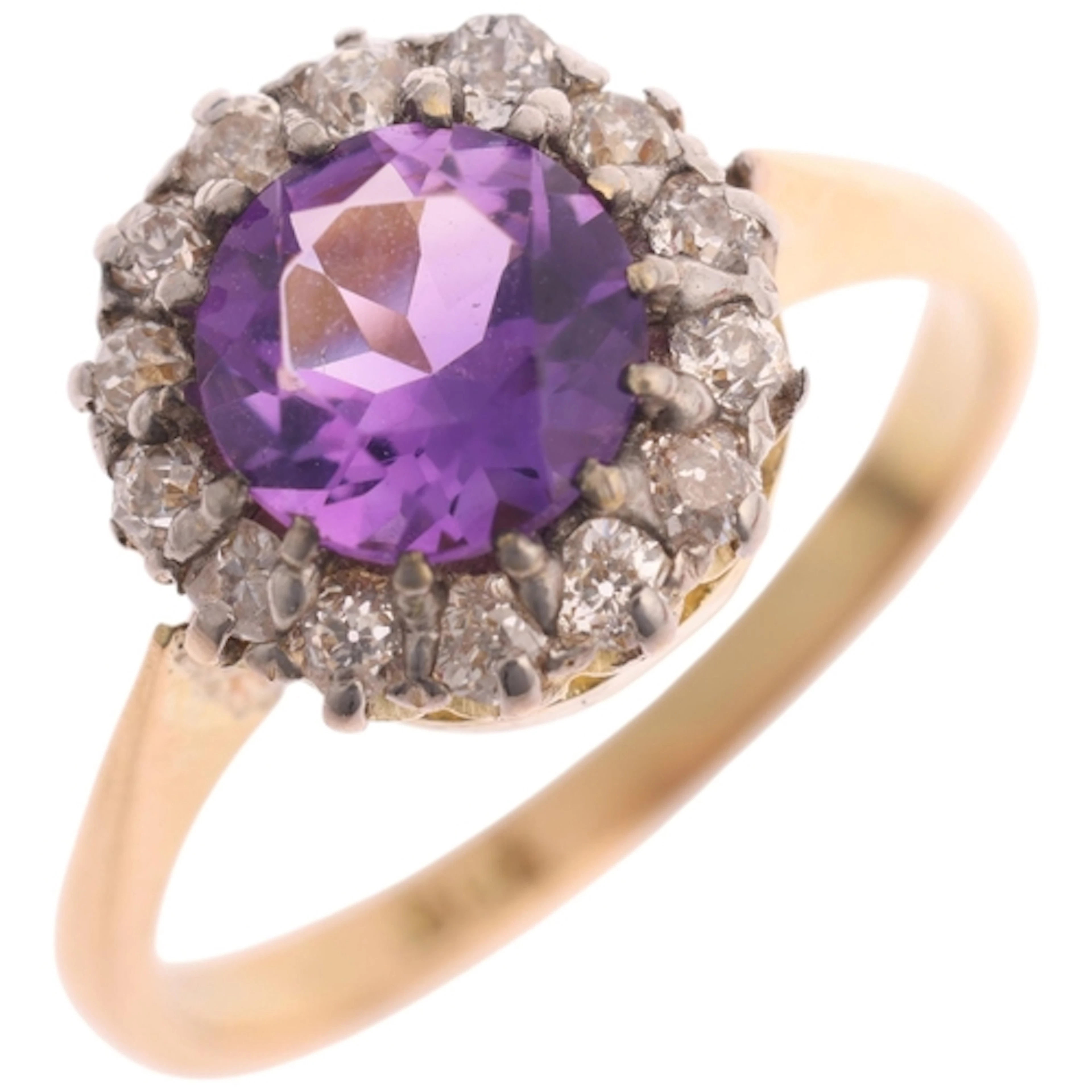 An 18ct gold amethyst and diamond cluster ring, claw set wit...
