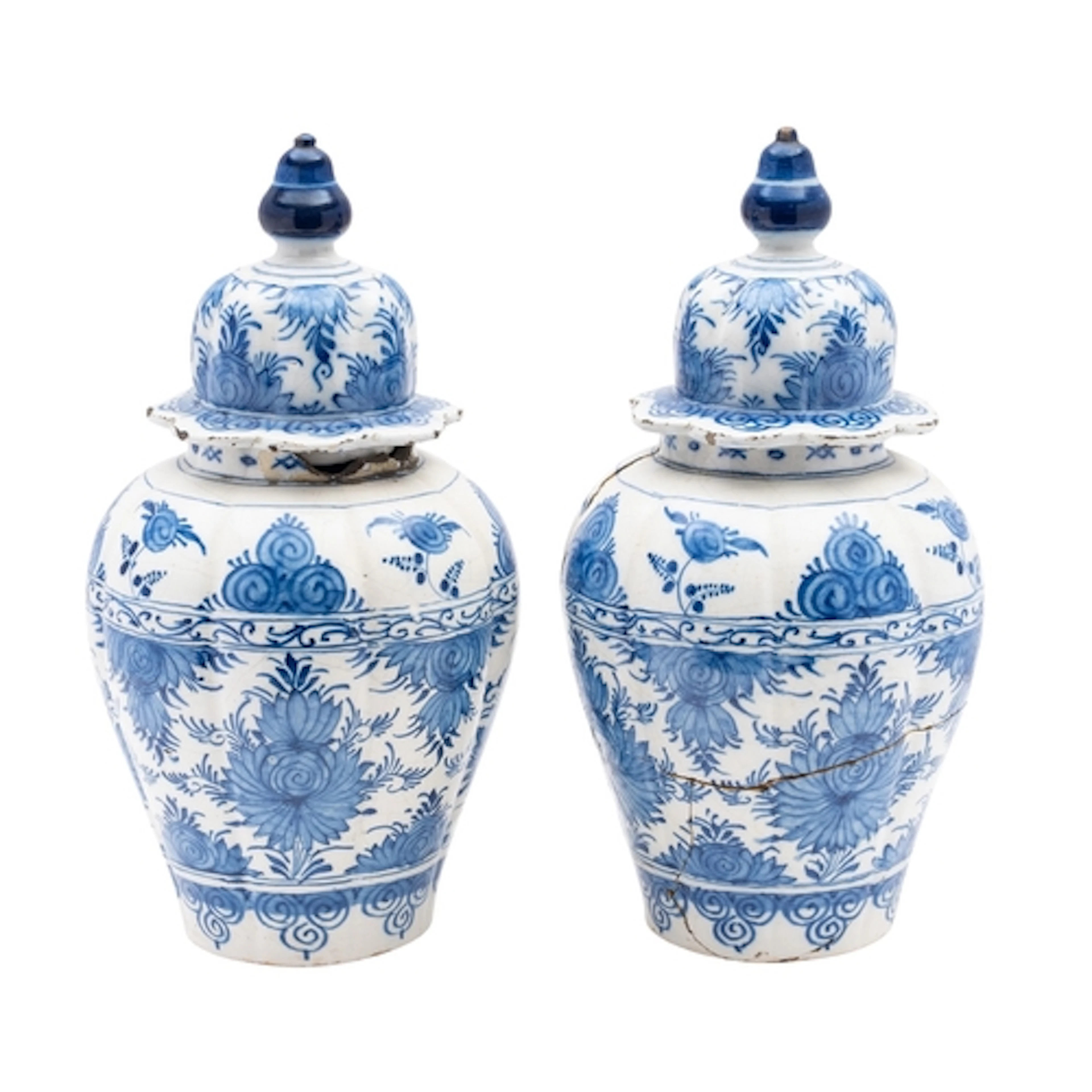 A pair of Dutch Delft lobed jars and domed covers each paint...