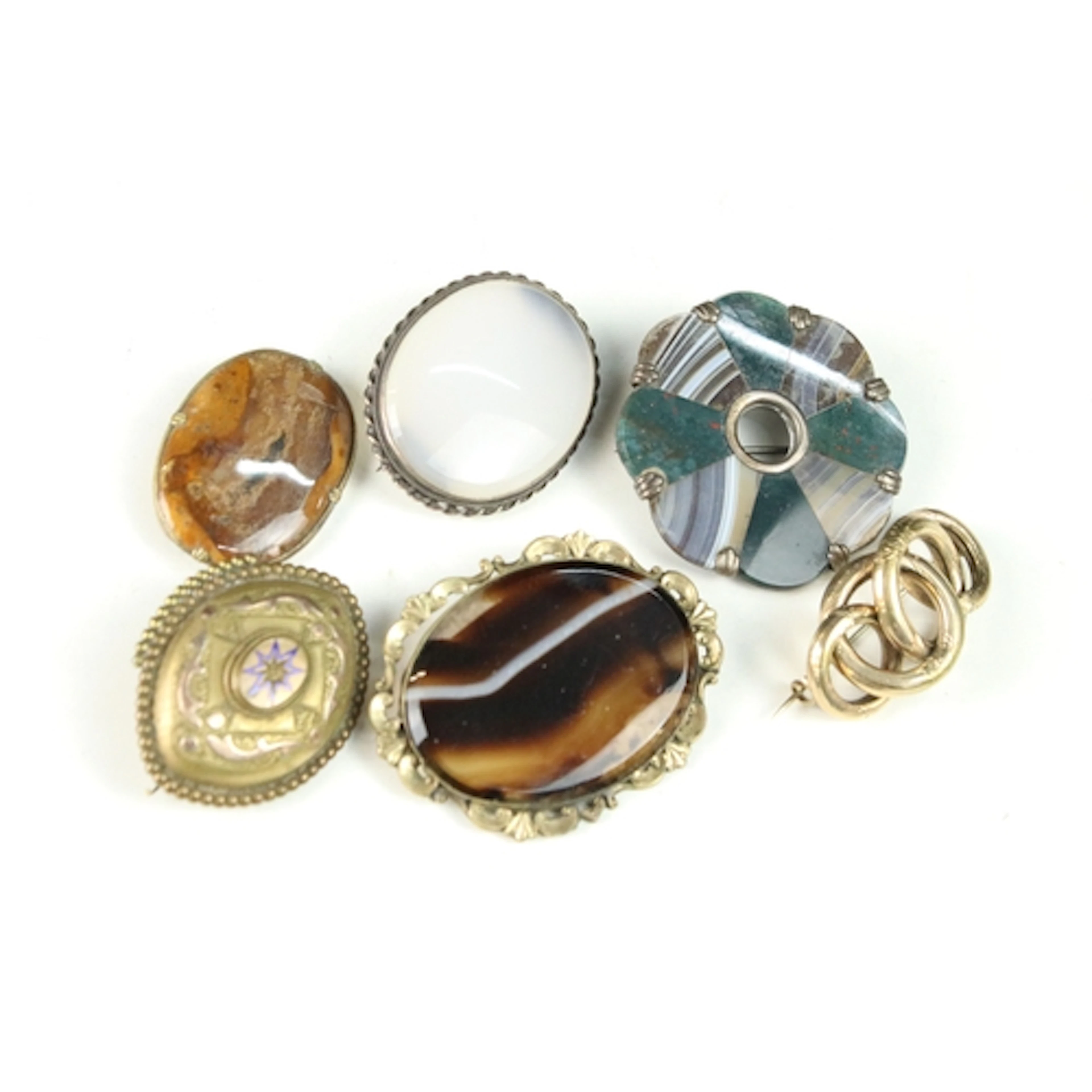 Small collection of brooches, to include: a Scottish white m...