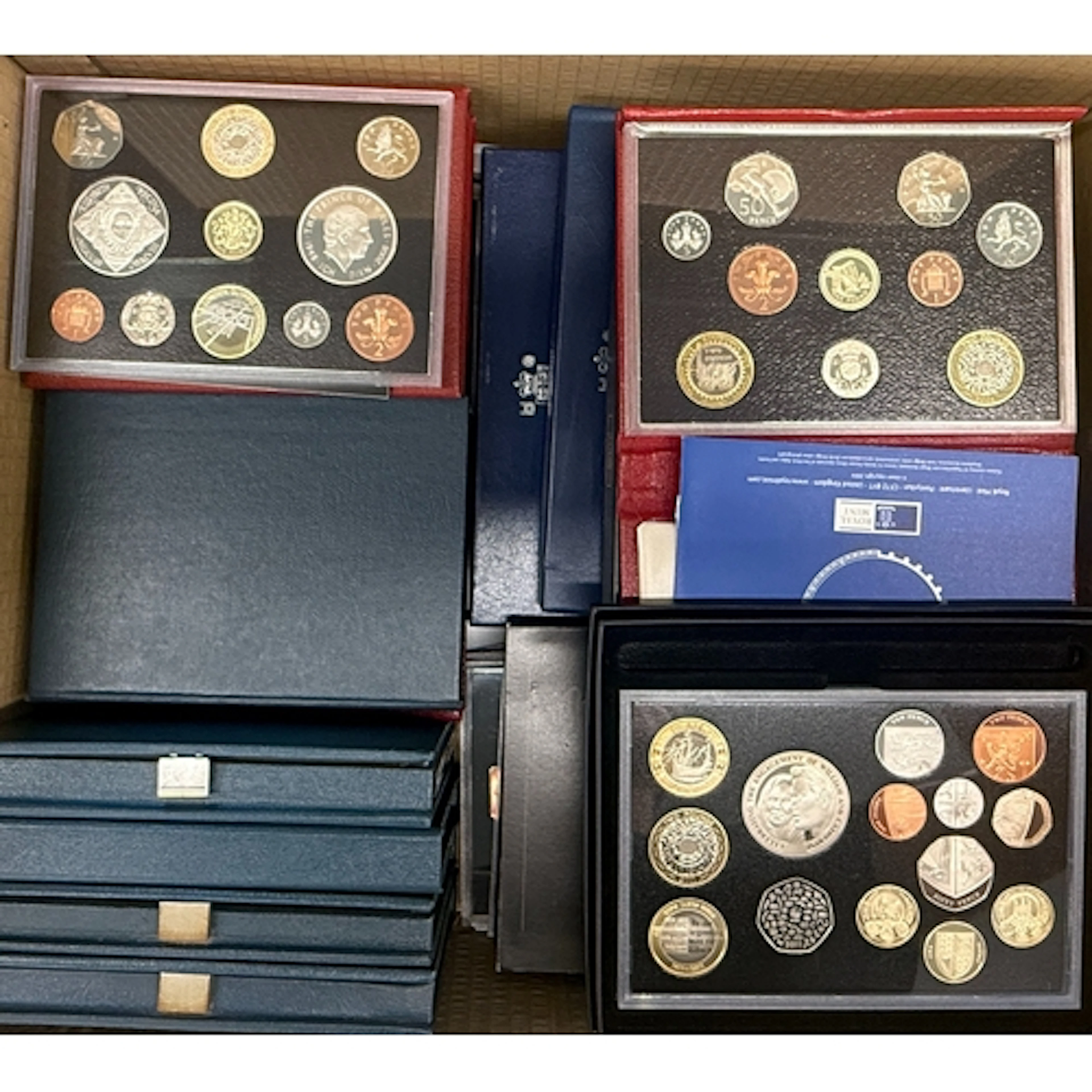 A collection of 22 UK QEII proof year sets, with duplication...