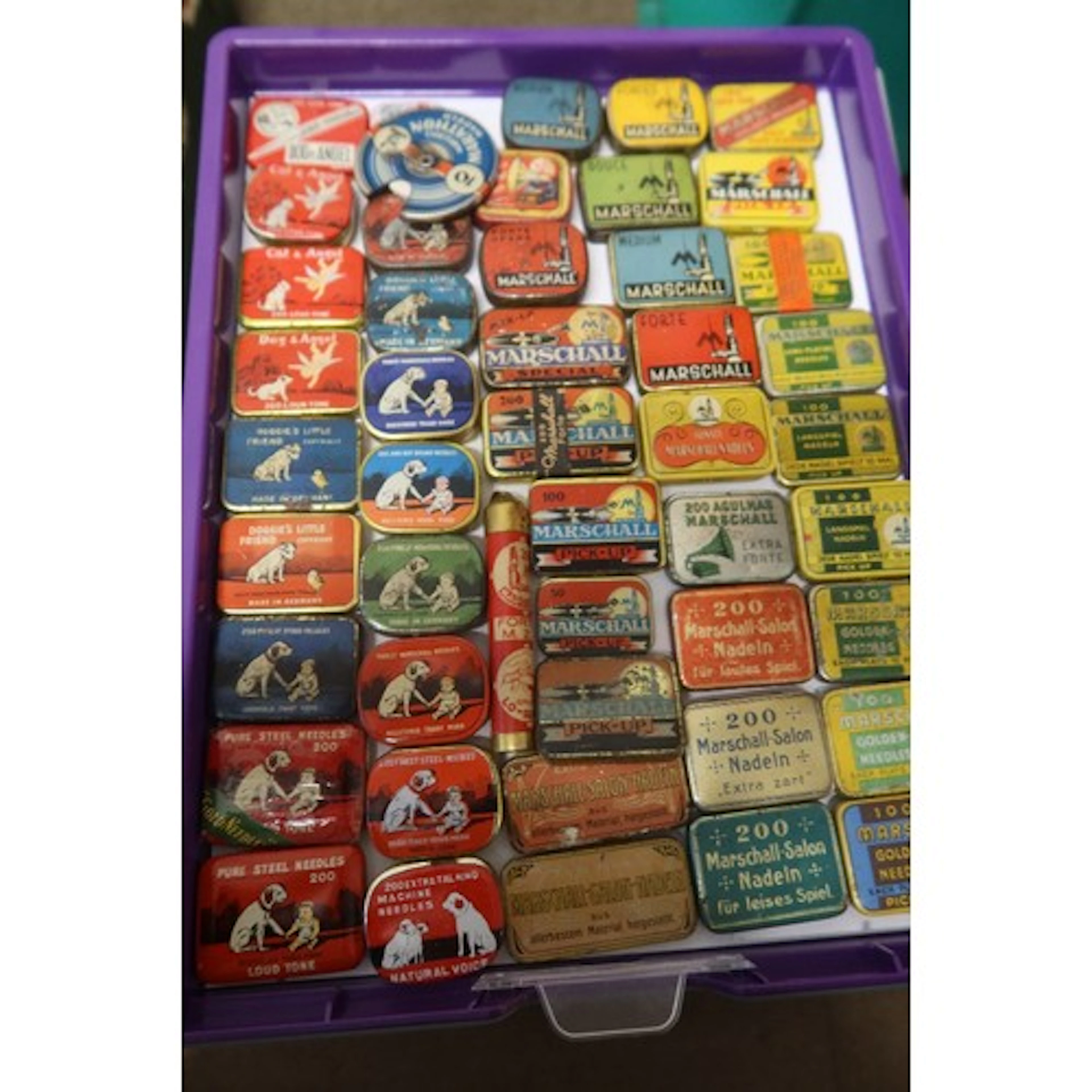 A tray of vintage gramophone needle tins