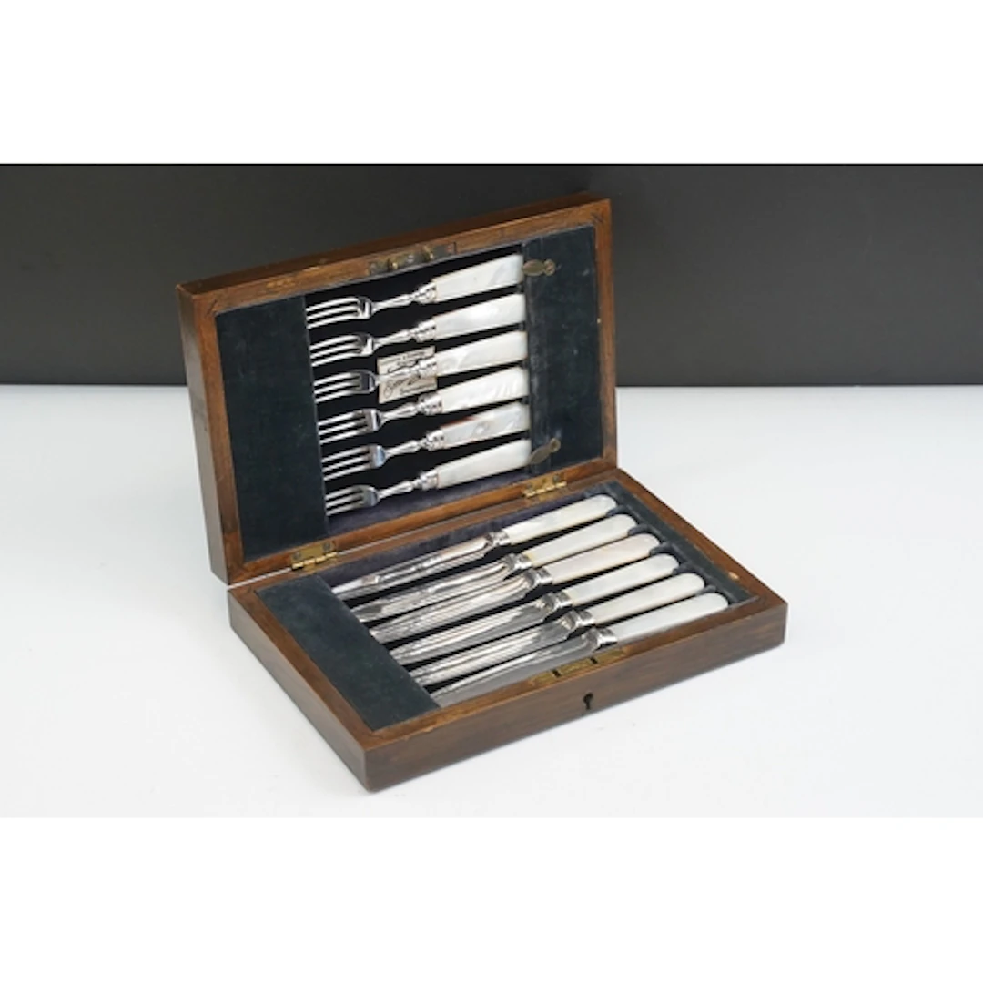 Set of twelve mother of pearl tea knives and forks, with sil...