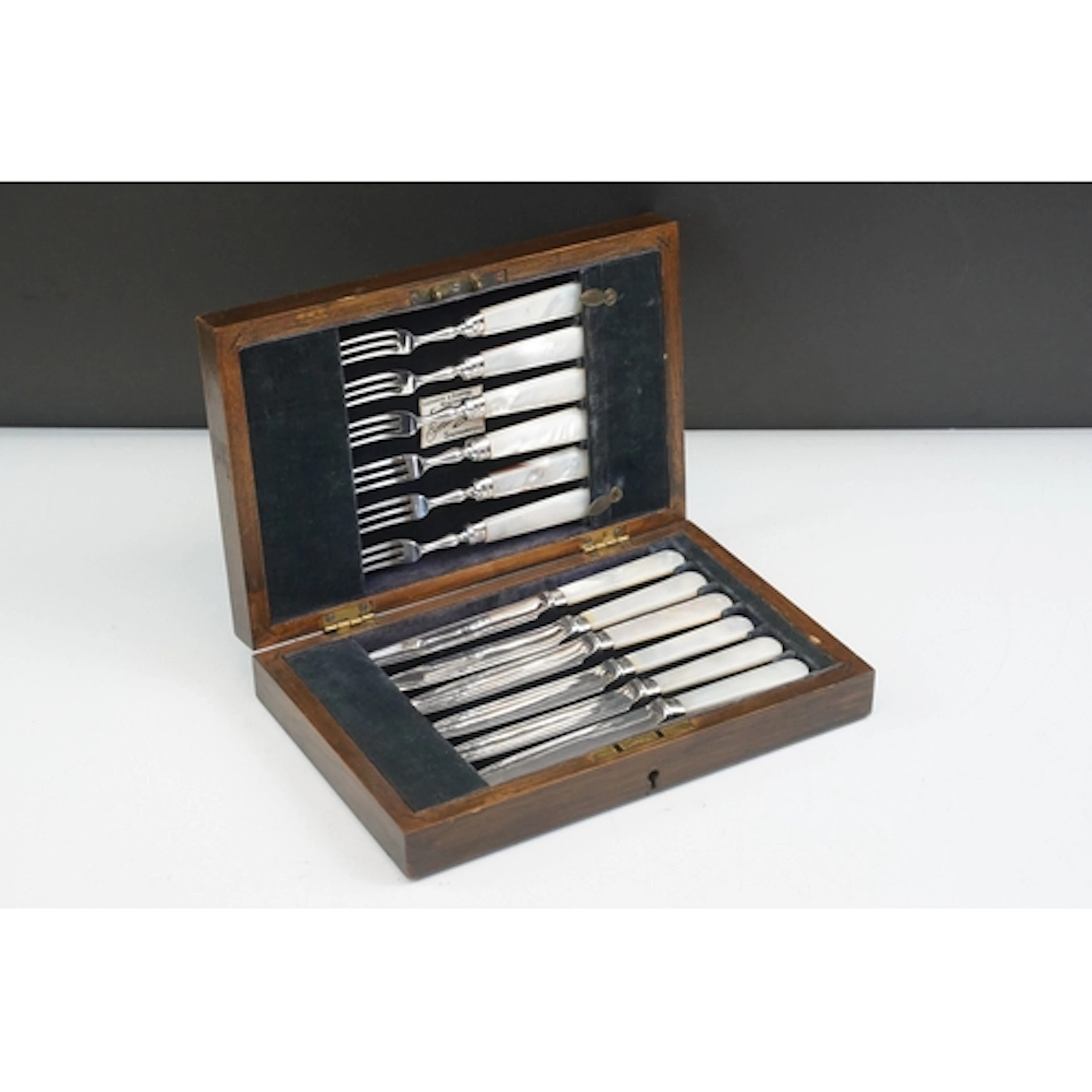 Set of twelve mother of pearl tea knives and forks, with sil...