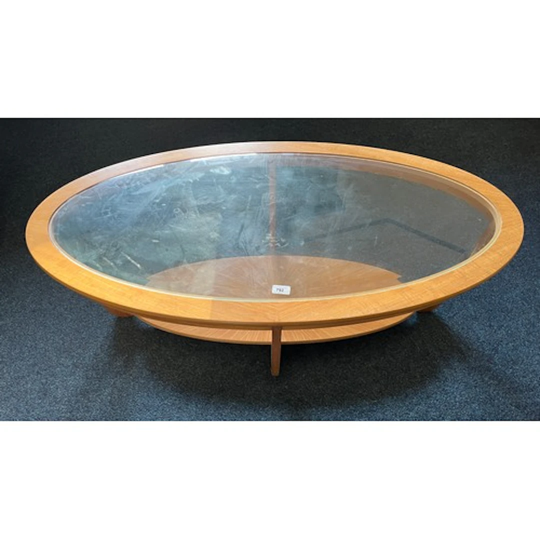 Nathan teak oval glass topped coffee table. 120cm wide.