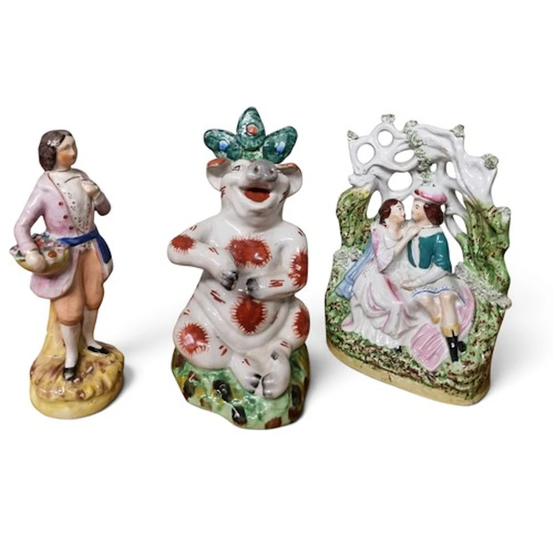 A 19th century Staffordshire hand-painted figure of a garden...